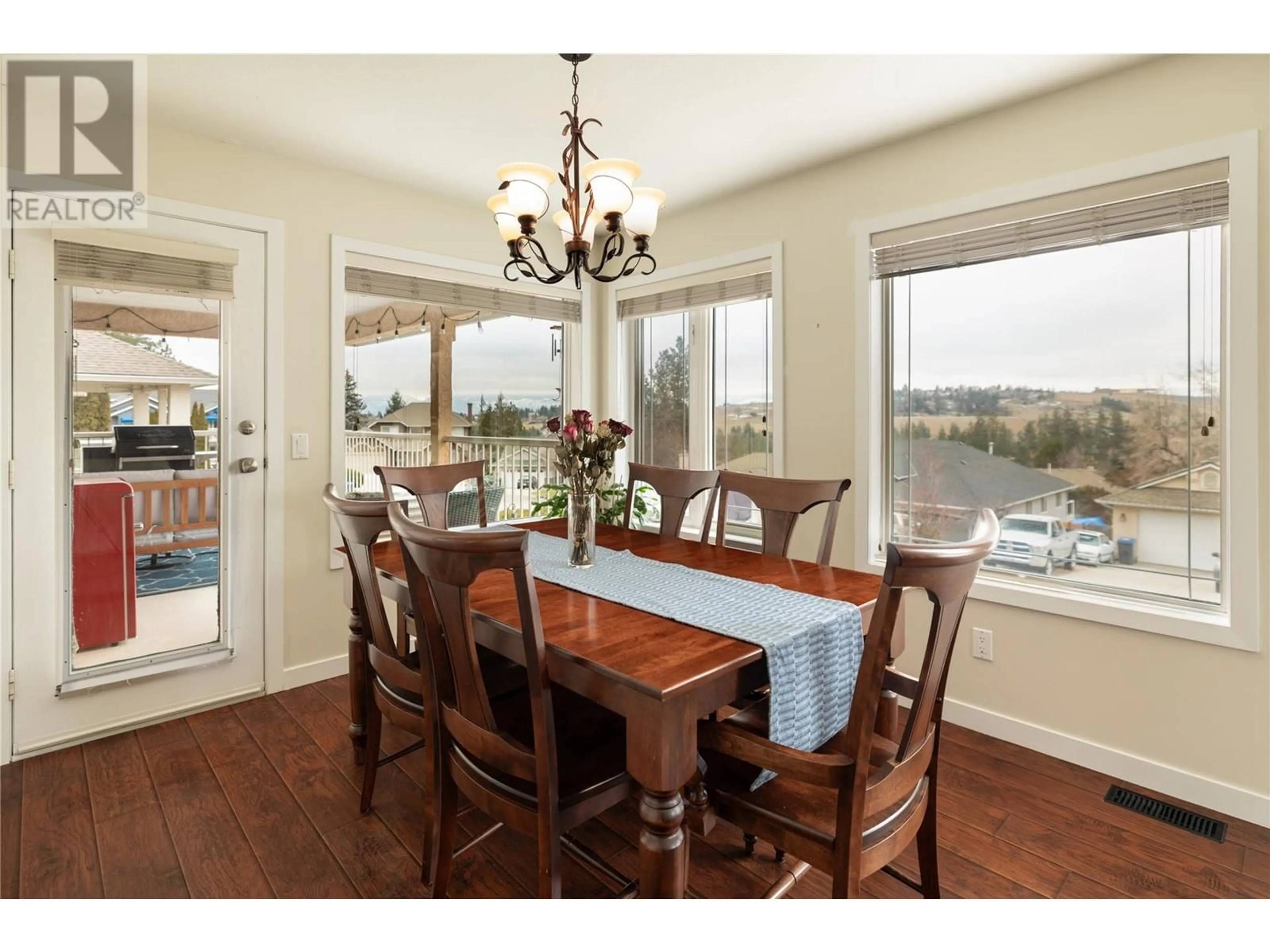 Dining room, wood/laminate floor for 1068 Caledonia Way, West Kelowna British Columbia V1Z3N7