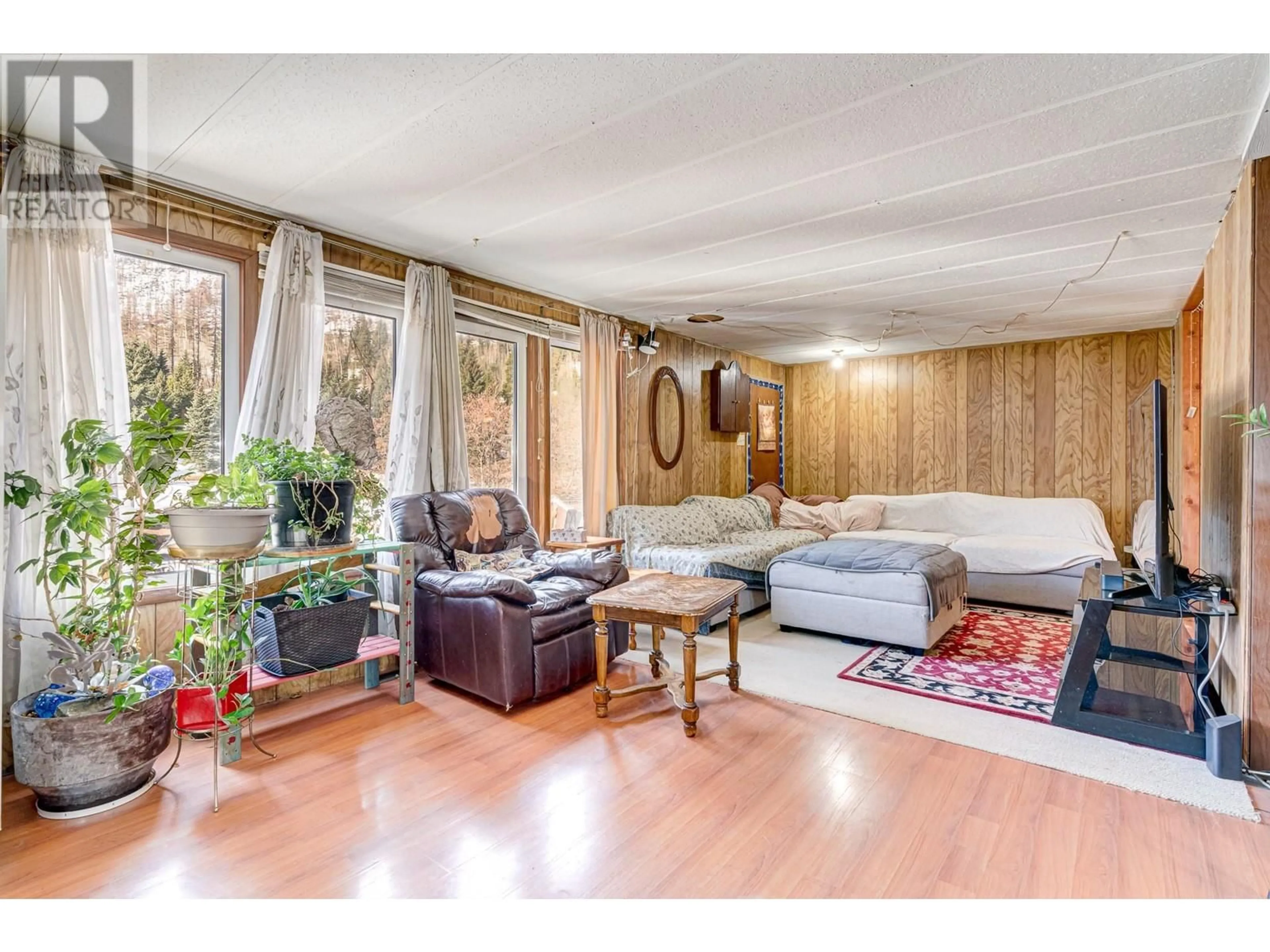 Living room with furniture, wood/laminate floor for 1191 MATEVIC ROAD, Sparwood British Columbia V0B2G1