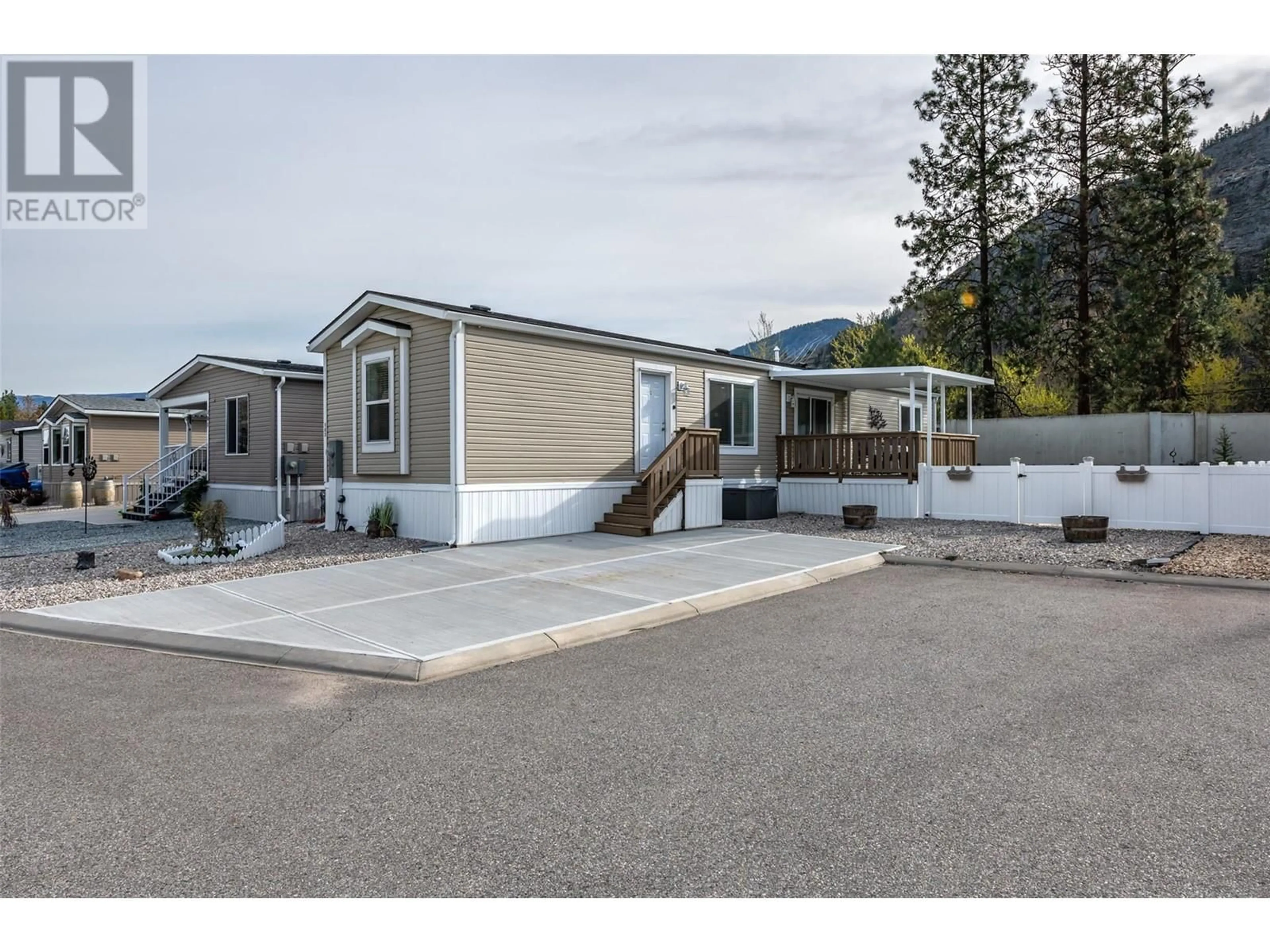 Home with vinyl exterior material, mountain view for 102 - 8598 HWY 97 OTHER, Oliver British Columbia V0H1T2
