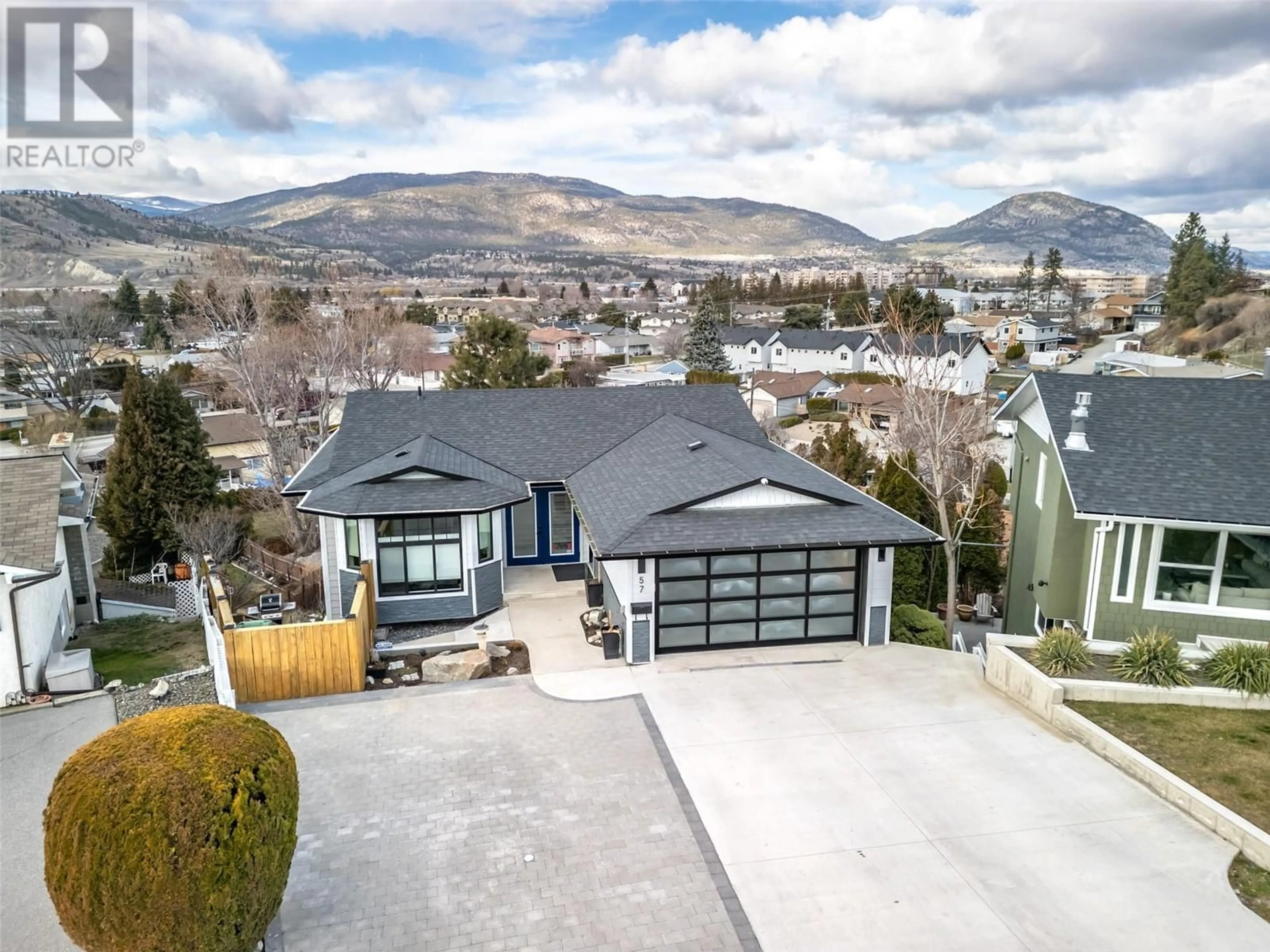 A pic from outside/outdoor area/front of a property/back of a property/a pic from drone, mountain view for 57 Greenwood Drive, Penticton British Columbia V2A7P8