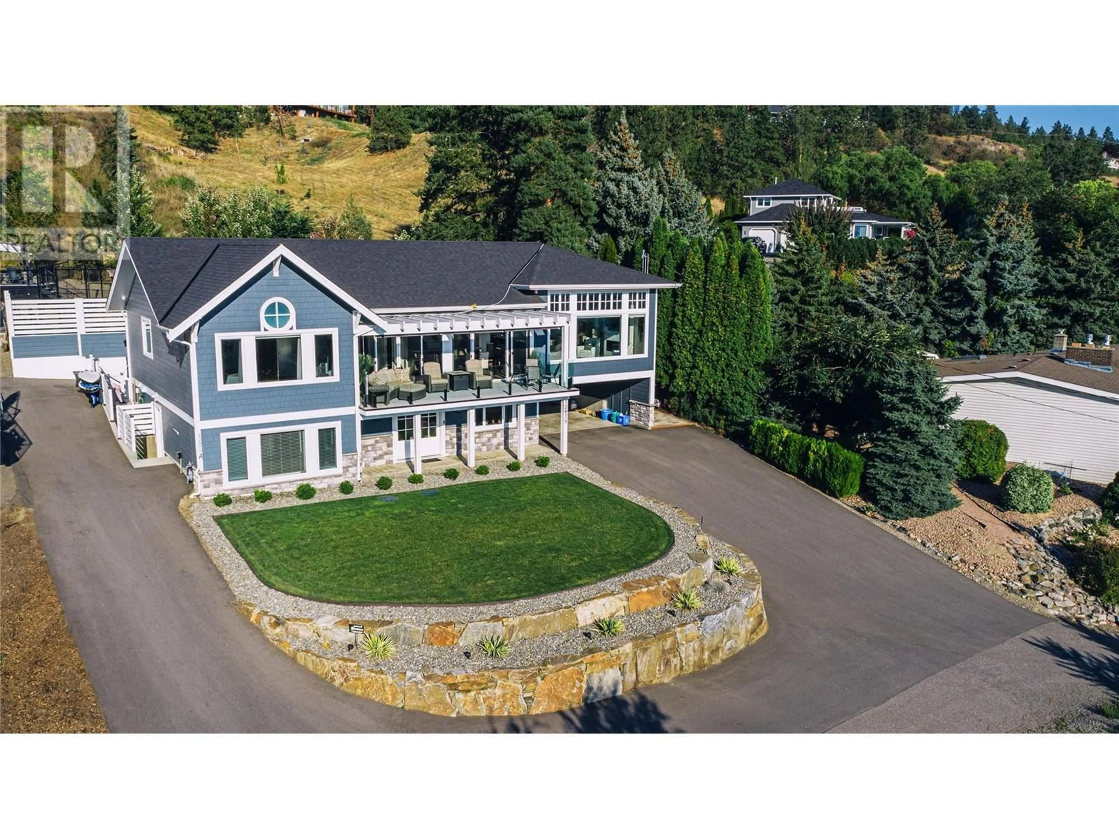 A pic from outside/outdoor area/front of a property/back of a property/a pic from drone, mountain view for 12879 Pixton Road, Lake Country British Columbia V4V1C9