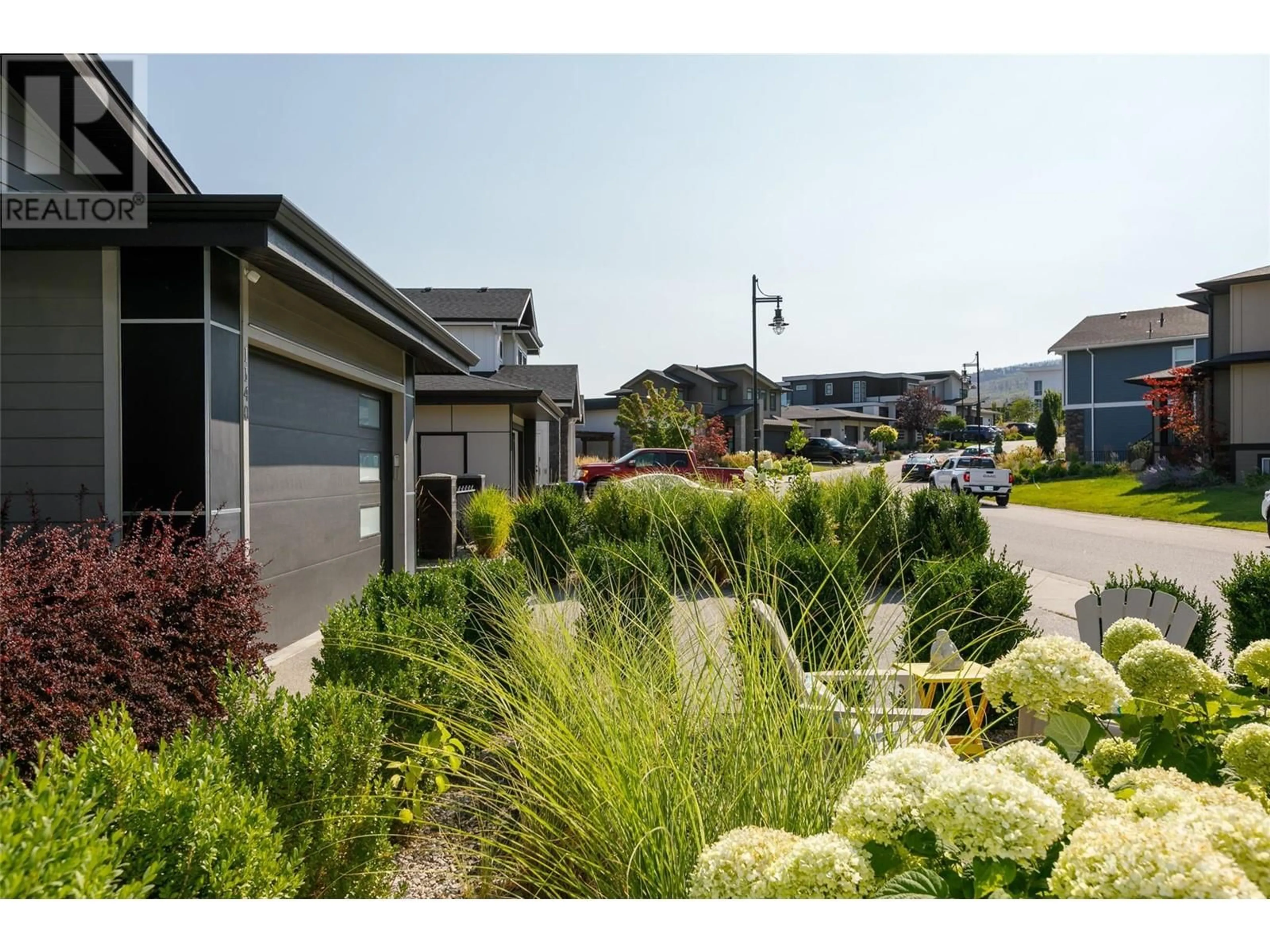 A pic from outside/outdoor area/front of a property/back of a property/a pic from drone, street for 1140 Goldfinch Place, Kelowna British Columbia V1W5M1