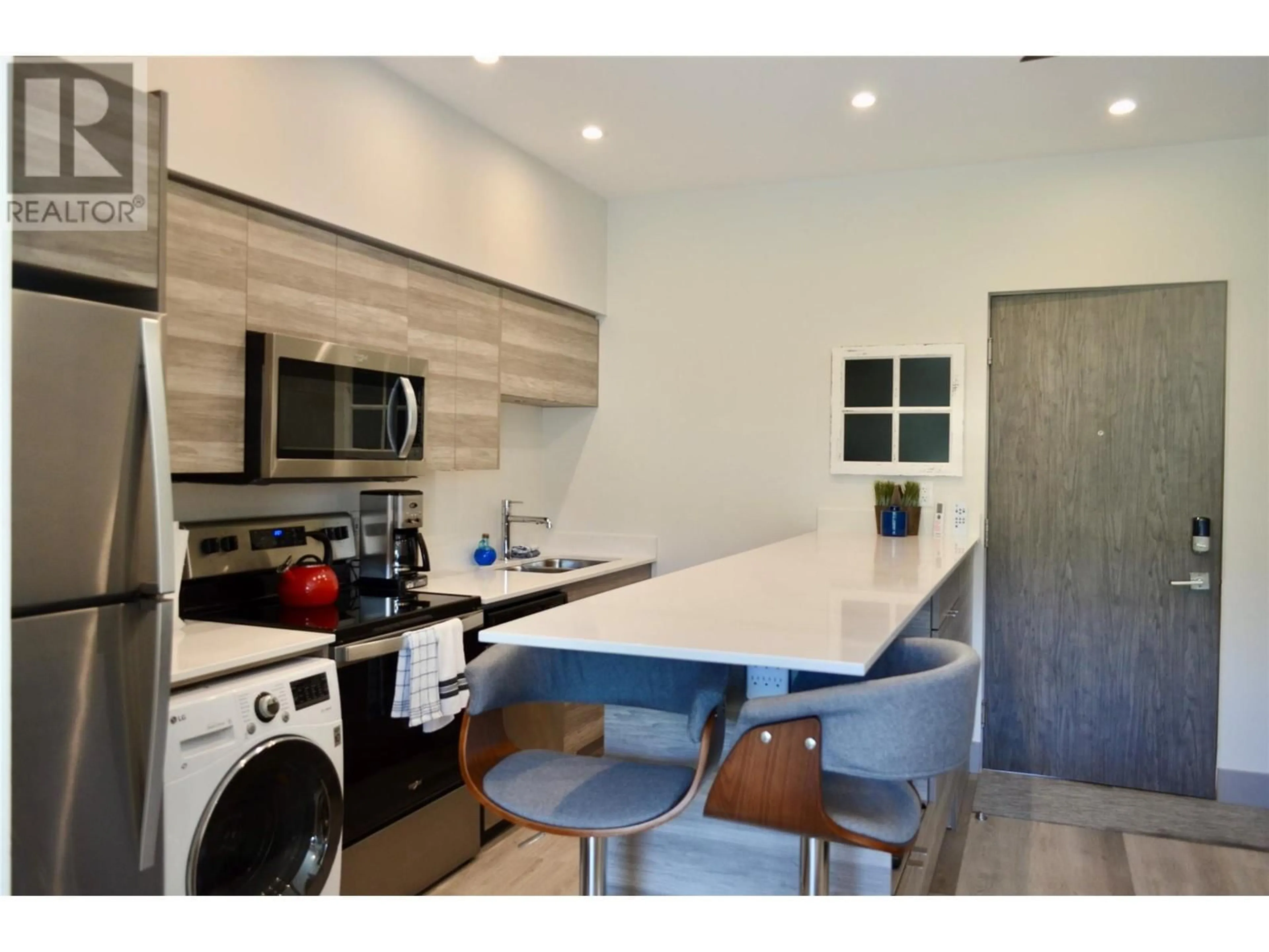 Open concept kitchen, unknown for 2555 Lakeshore Road Unit# 221, Vernon British Columbia V1H0A4