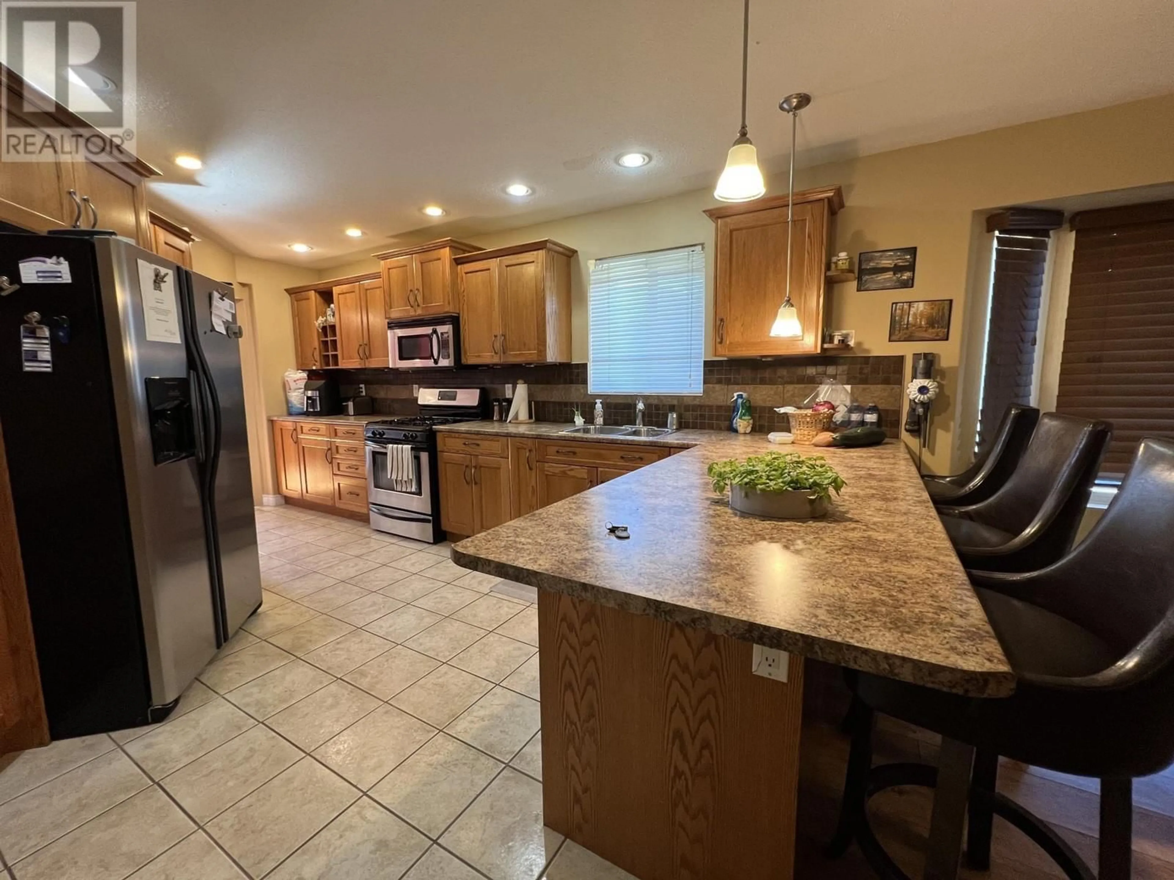 Open concept kitchen, ceramic/tile floor for 1661 BANN Street, Merritt British Columbia V1K1E9