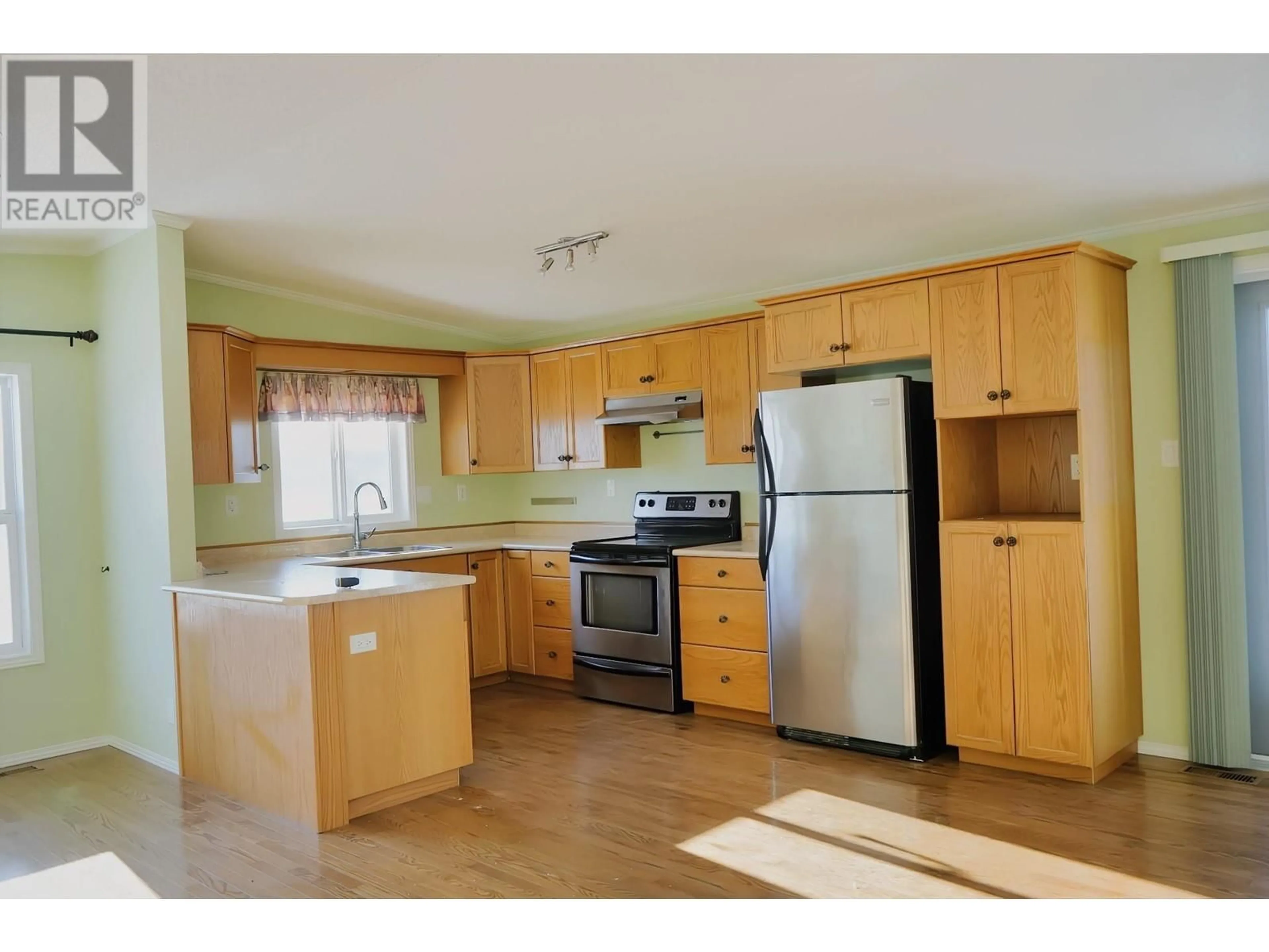 Standard kitchen, wood/laminate floor for 9800 18 Street Unit# 9, Dawson Creek British Columbia V1G5A4