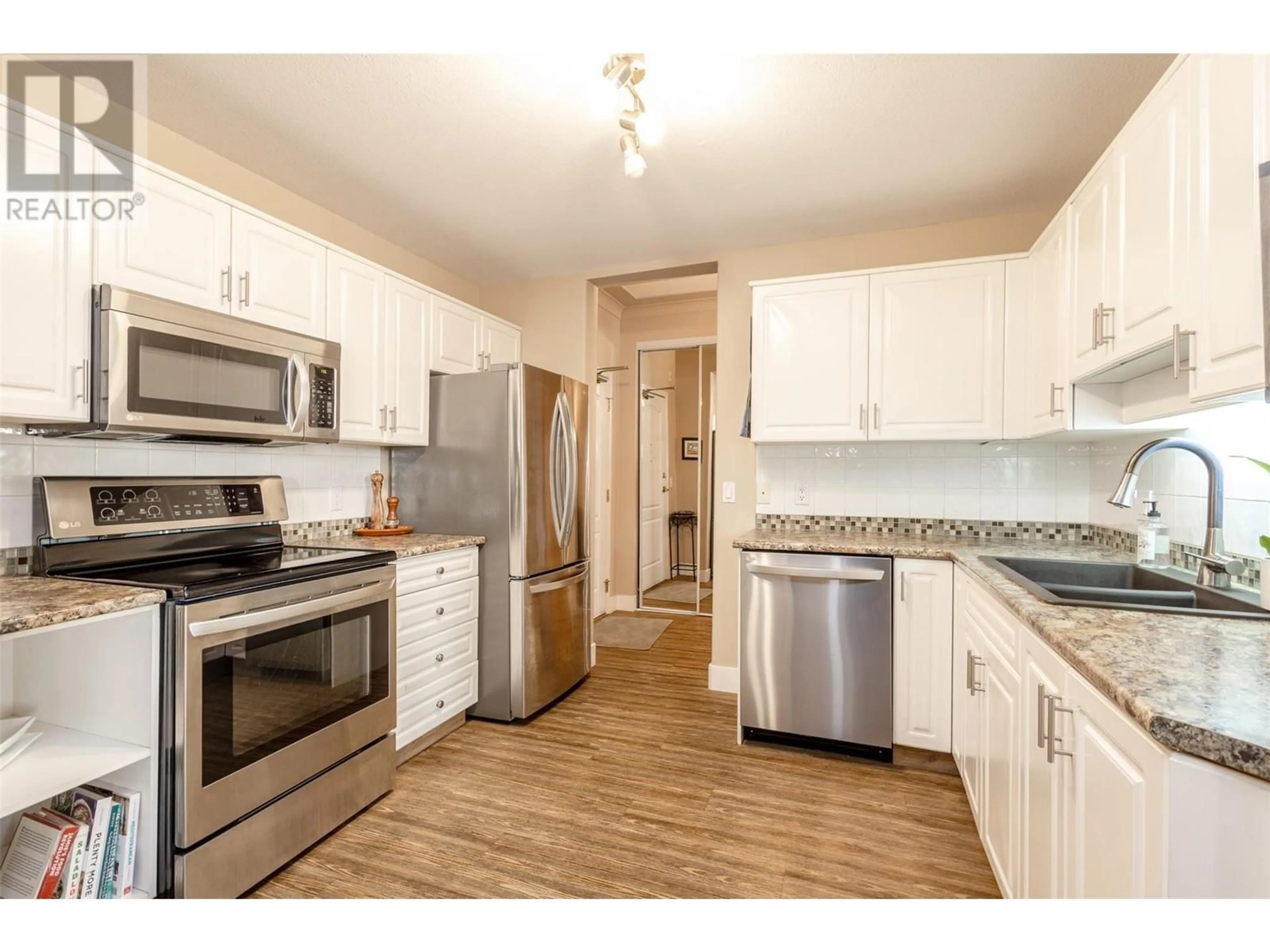 Standard kitchen, wood/laminate floor for 1966 Enterprise Way Unit# 111, Kelowna British Columbia V1Y3S8