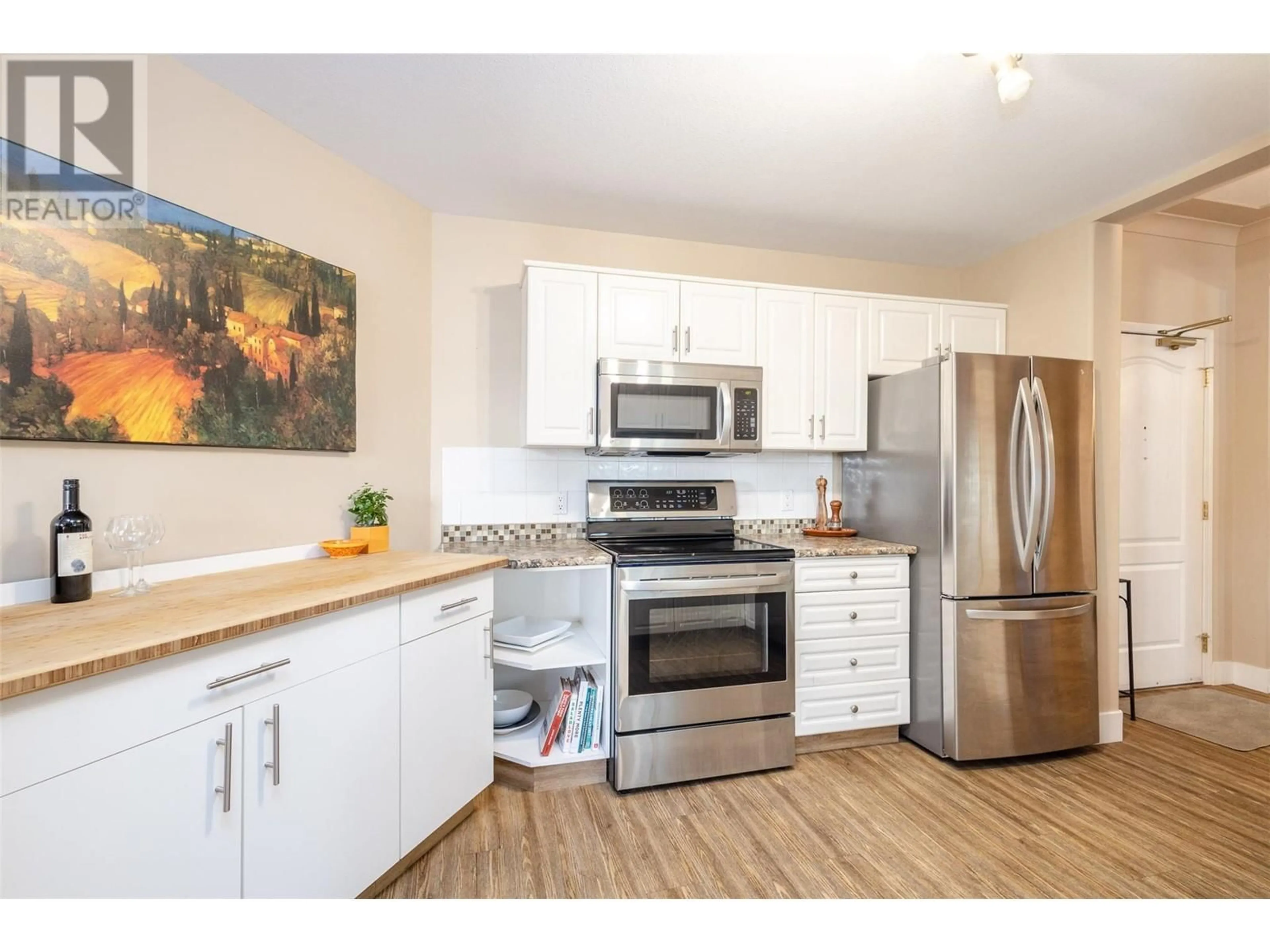 Standard kitchen, wood/laminate floor for 1966 Enterprise Way Unit# 111, Kelowna British Columbia V1Y3S8