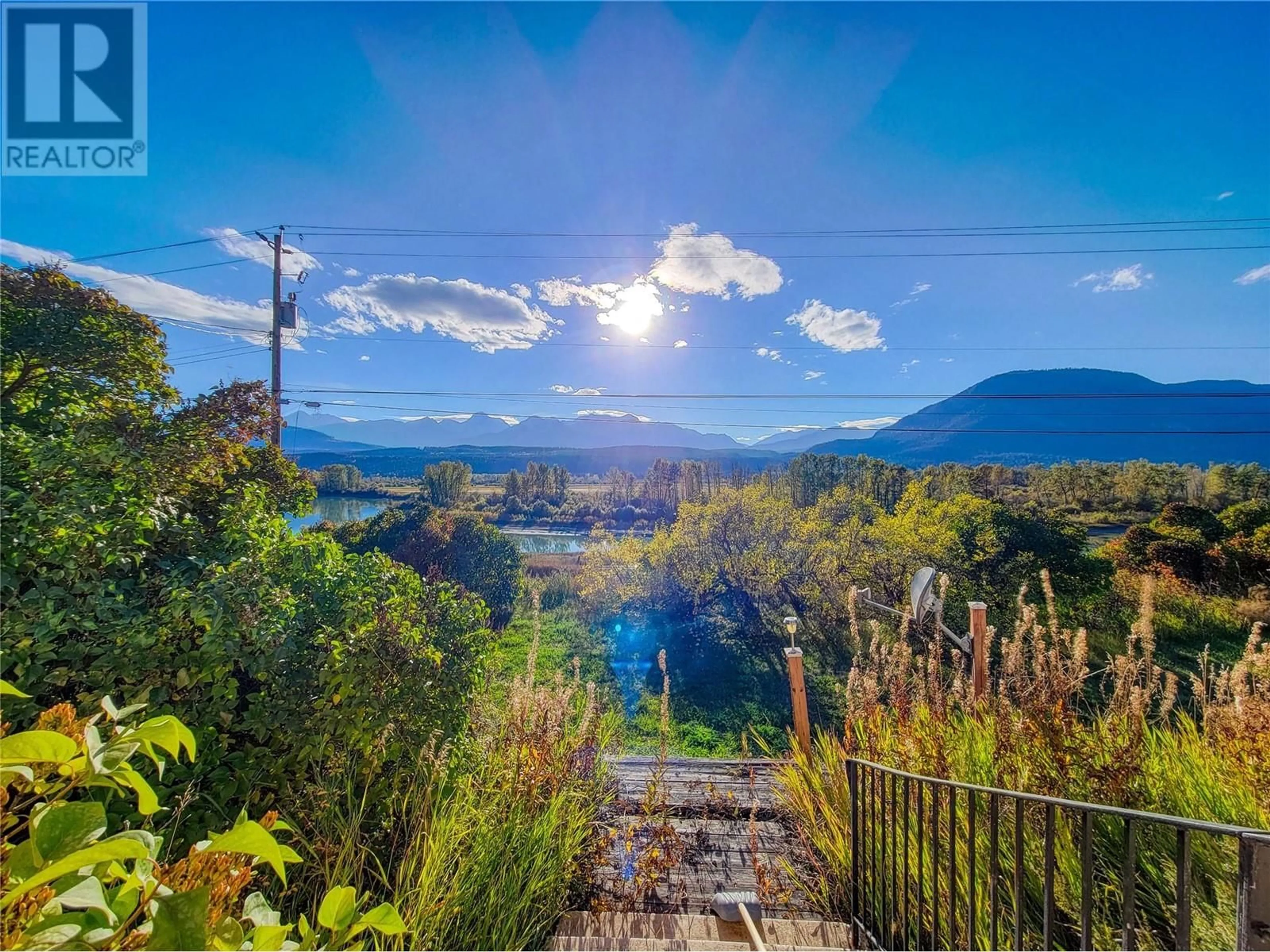 A pic from outside/outdoor area/front of a property/back of a property/a pic from drone, water/lake/river/ocean view for 960 95 Highway, Spillimacheen British Columbia V0A1P0