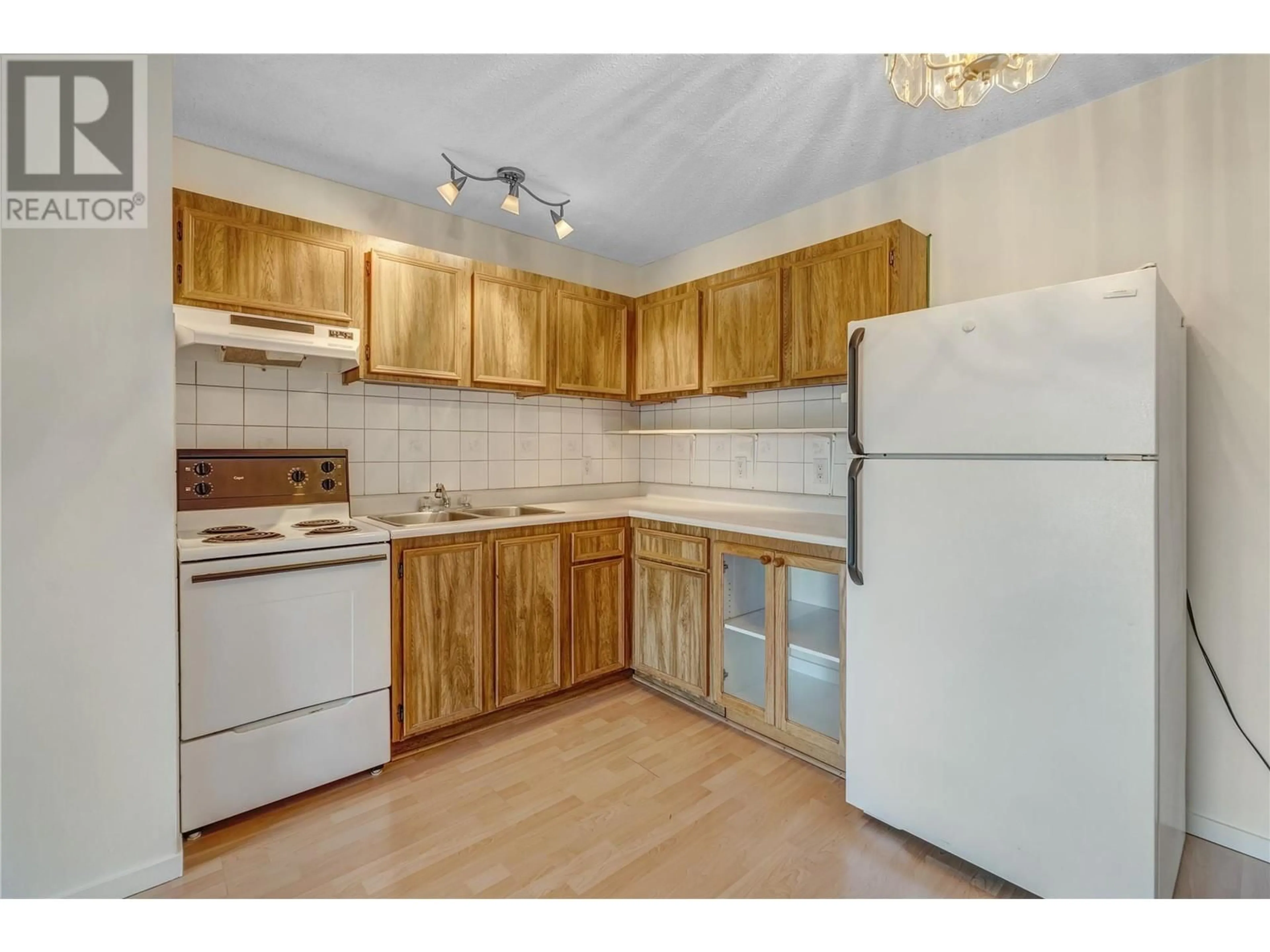 Standard kitchen, wood/laminate floor for 311 - 130 SKAHA PLACE, Penticton British Columbia V2A7J6