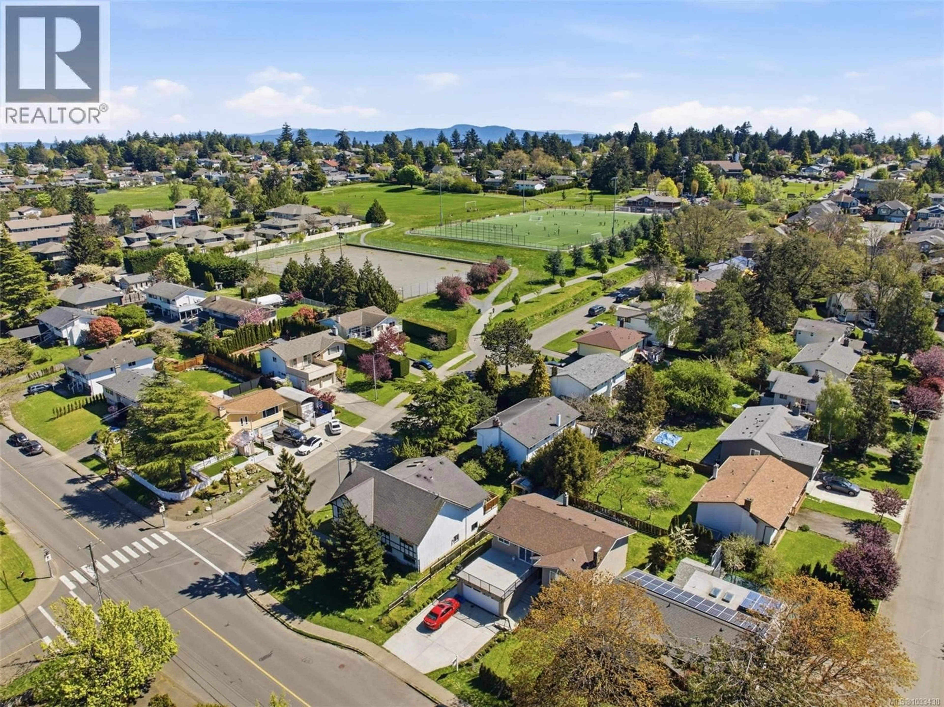 A pic from outside/outdoor area/front of a property/back of a property/a pic from drone, street for 4351 TORQUAY DRIVE, Saanich British Columbia V8N3L3