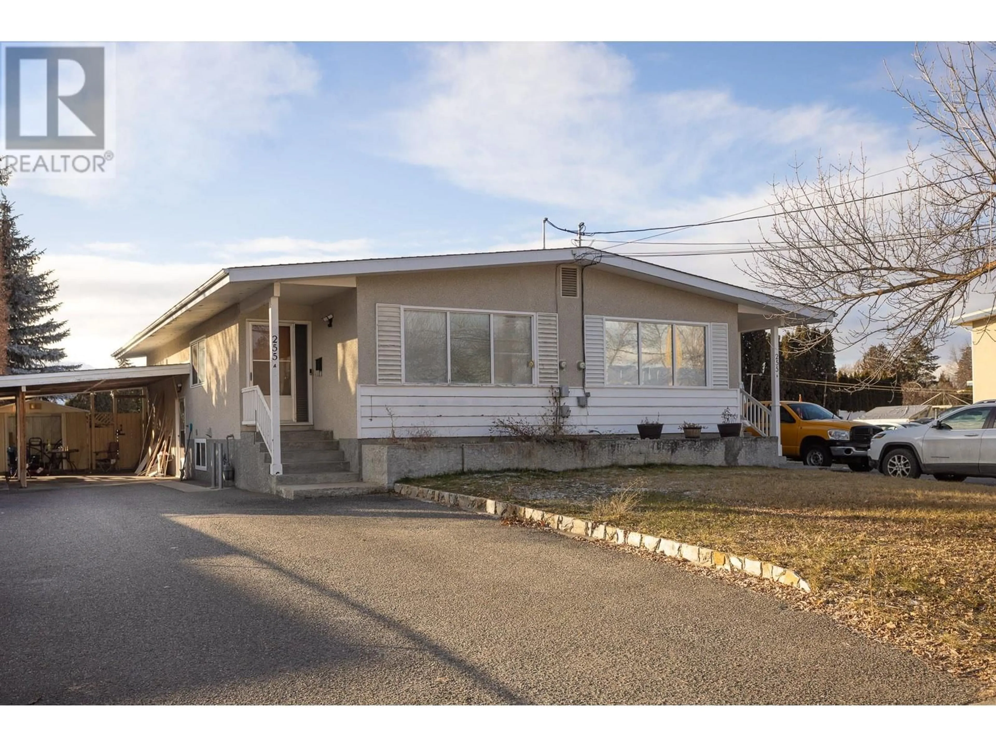 Home with vinyl exterior material, street for 255 Holbrook Road W, Kelowna British Columbia V1X1S1