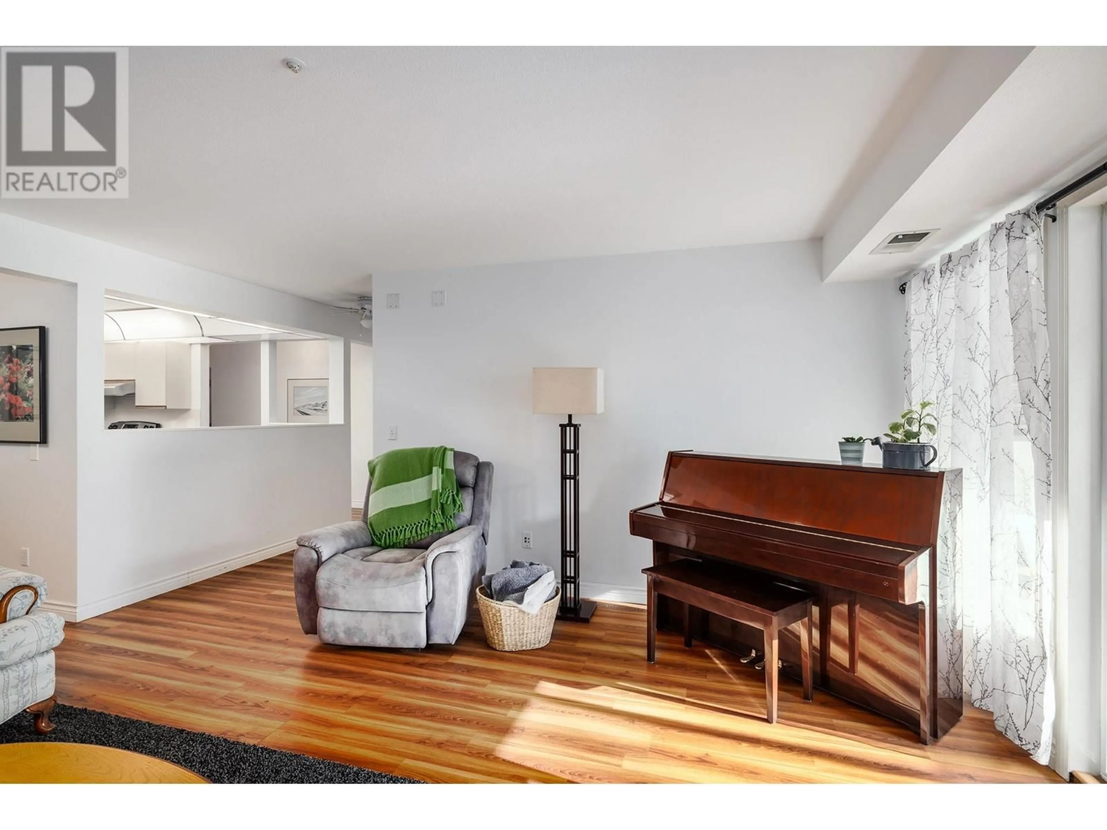 Living room with furniture, wood/laminate floor for 1045 Sutherland Avenue Unit# G40, Kelowna British Columbia V1Y5Y1