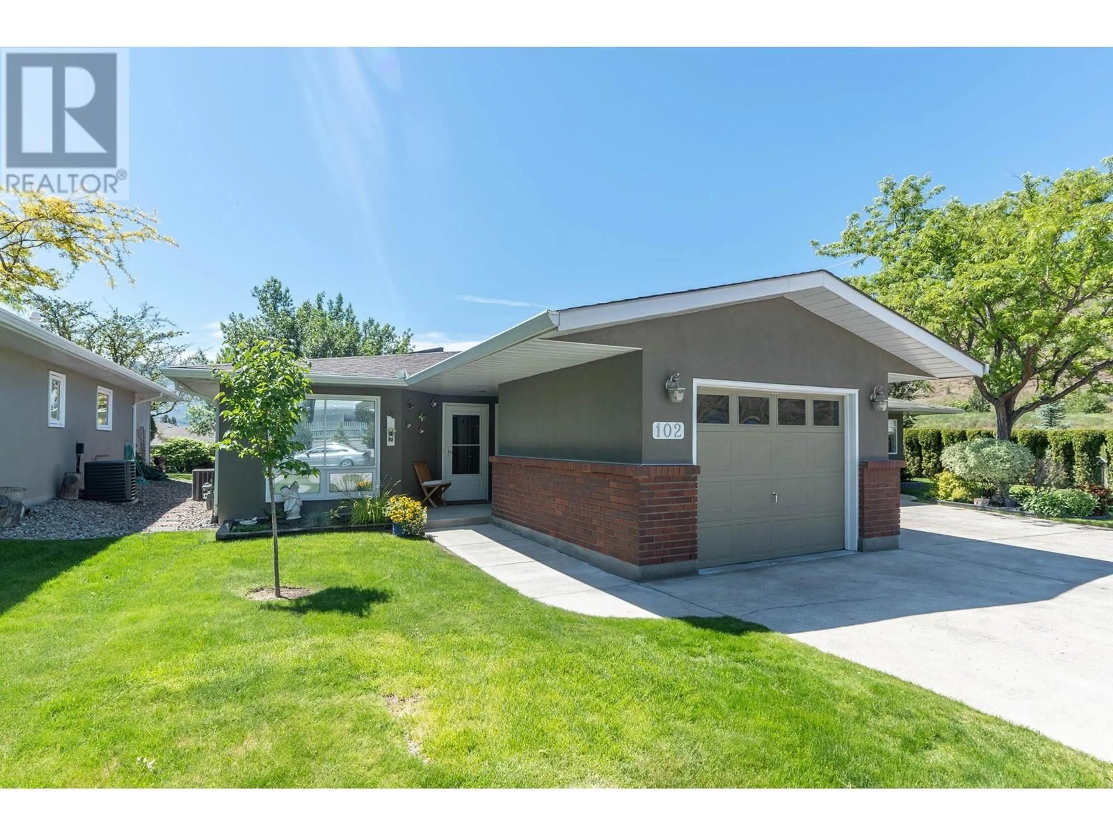 Home with vinyl exterior material, street for 102 - 4035 GELLATLY ROAD, West Kelowna British Columbia V4T1R7