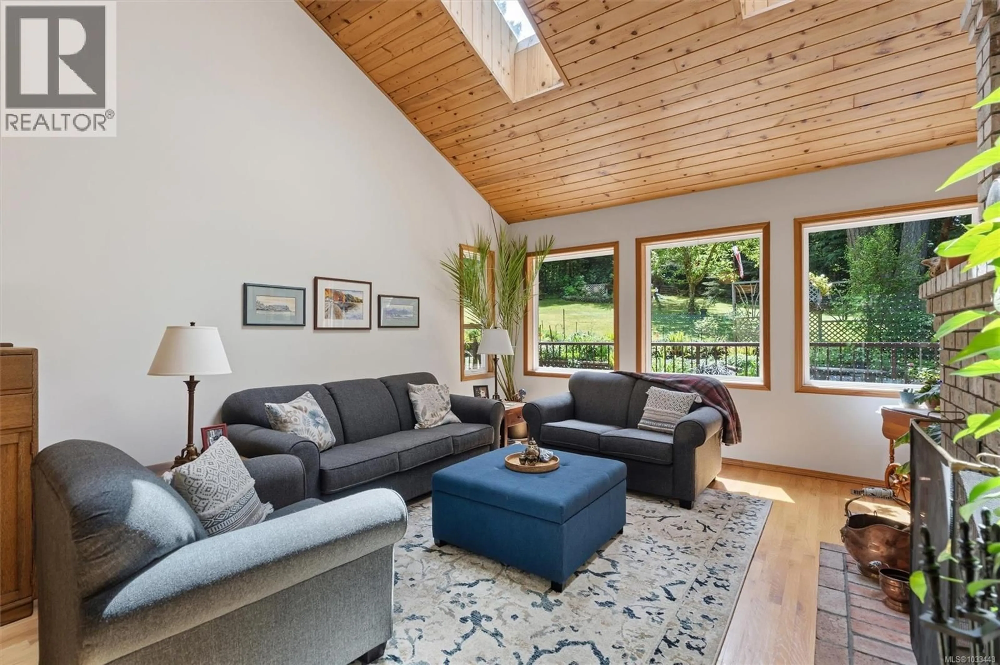 Living room with furniture, wood/laminate floor for 5729 EAST SOOKE ROAD, Sooke British Columbia V9Z0Z6