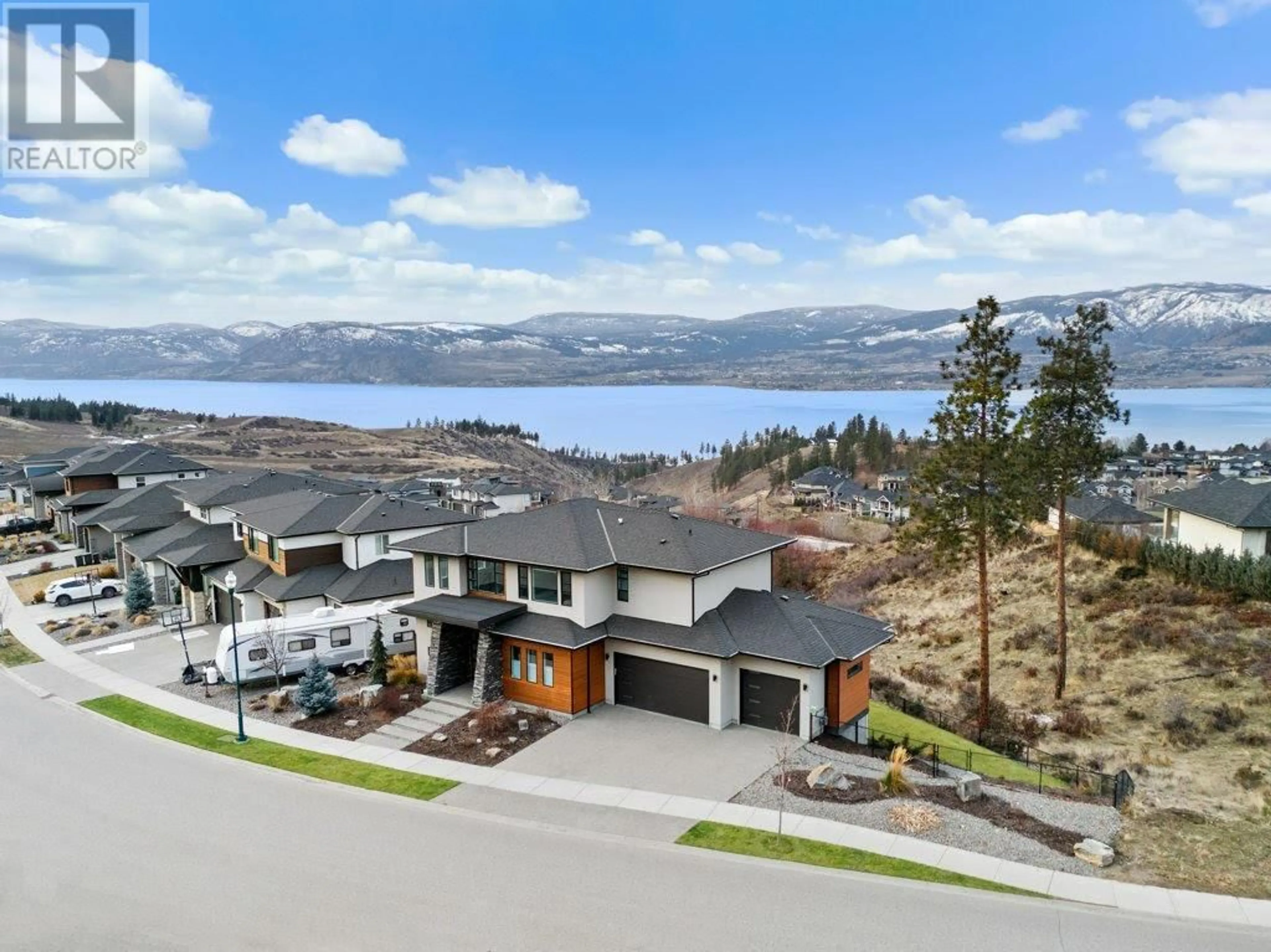 A pic from outside/outdoor area/front of a property/back of a property/a pic from drone, water/lake/river/ocean view for 5624 Mountainside Drive, Kelowna British Columbia V1W5L5