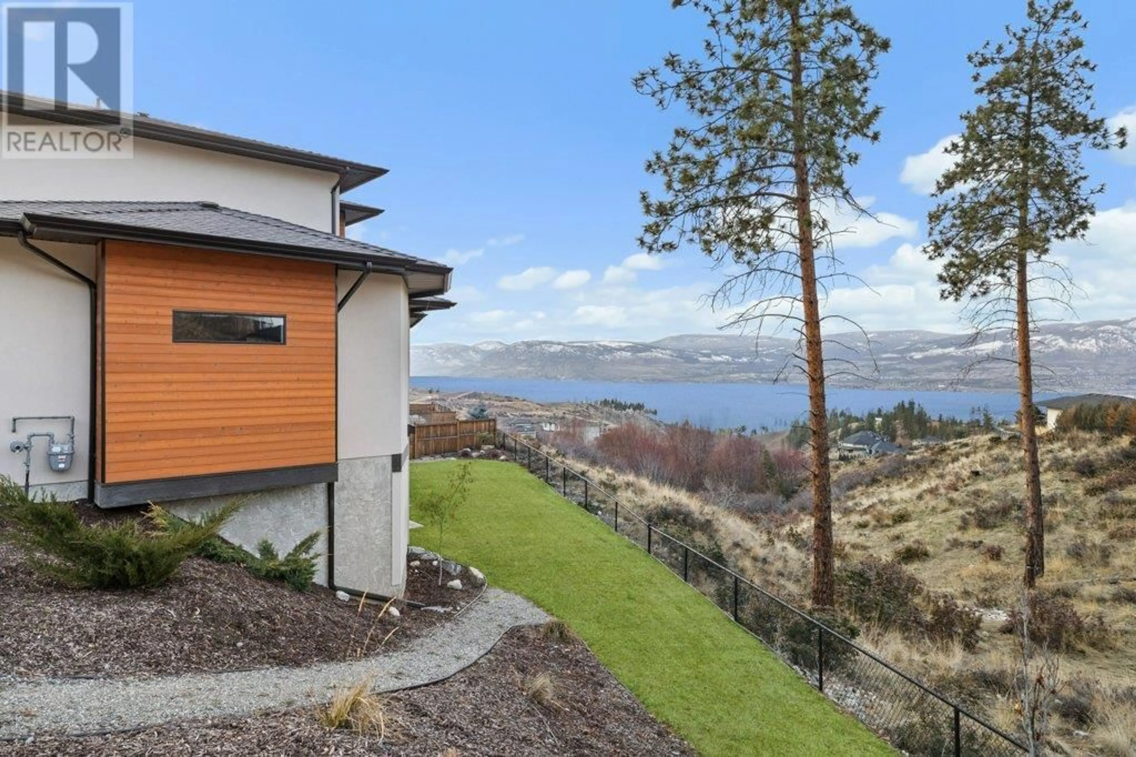 A pic from outside/outdoor area/front of a property/back of a property/a pic from drone, water/lake/river/ocean view for 5624 Mountainside Drive, Kelowna British Columbia V1W5L5