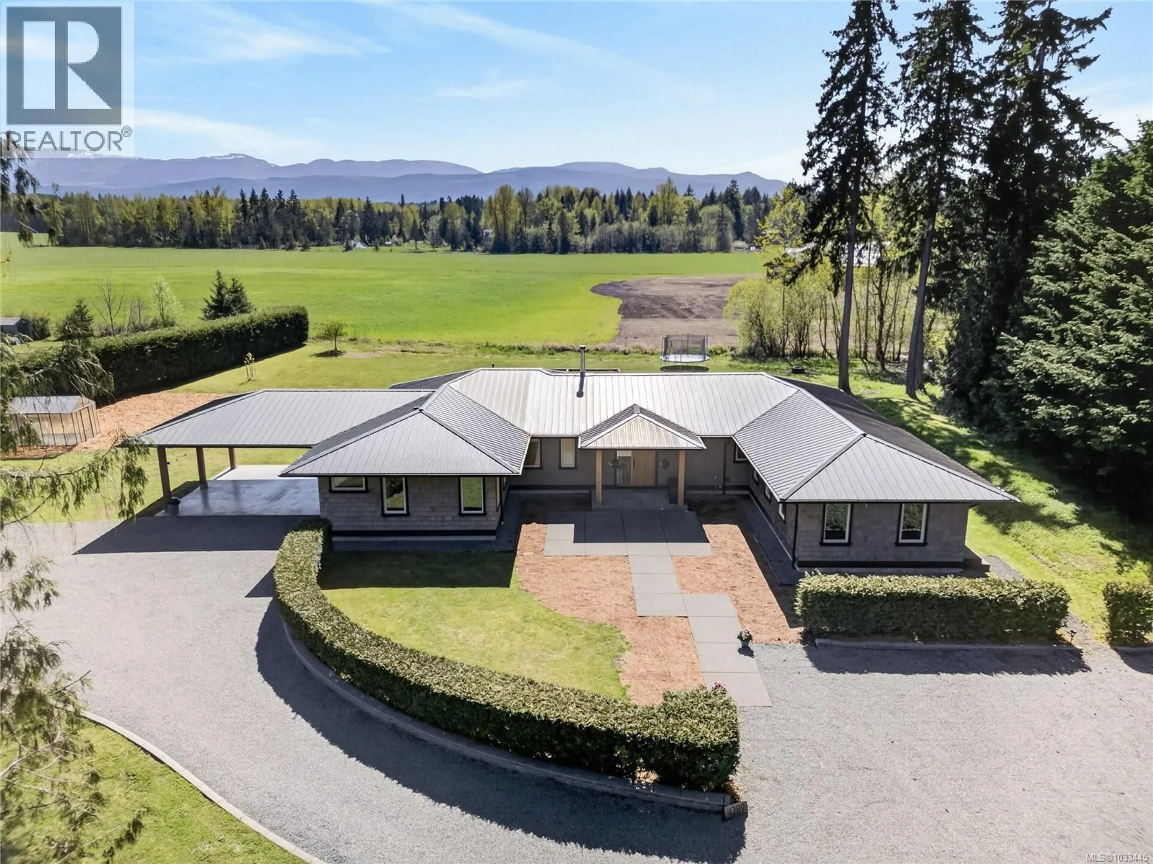 A pic from outside/outdoor area/front of a property/back of a property/a pic from drone, mountain view for 4287,4289 MARSDEN ROAD, Courtenay British Columbia V9N9N4