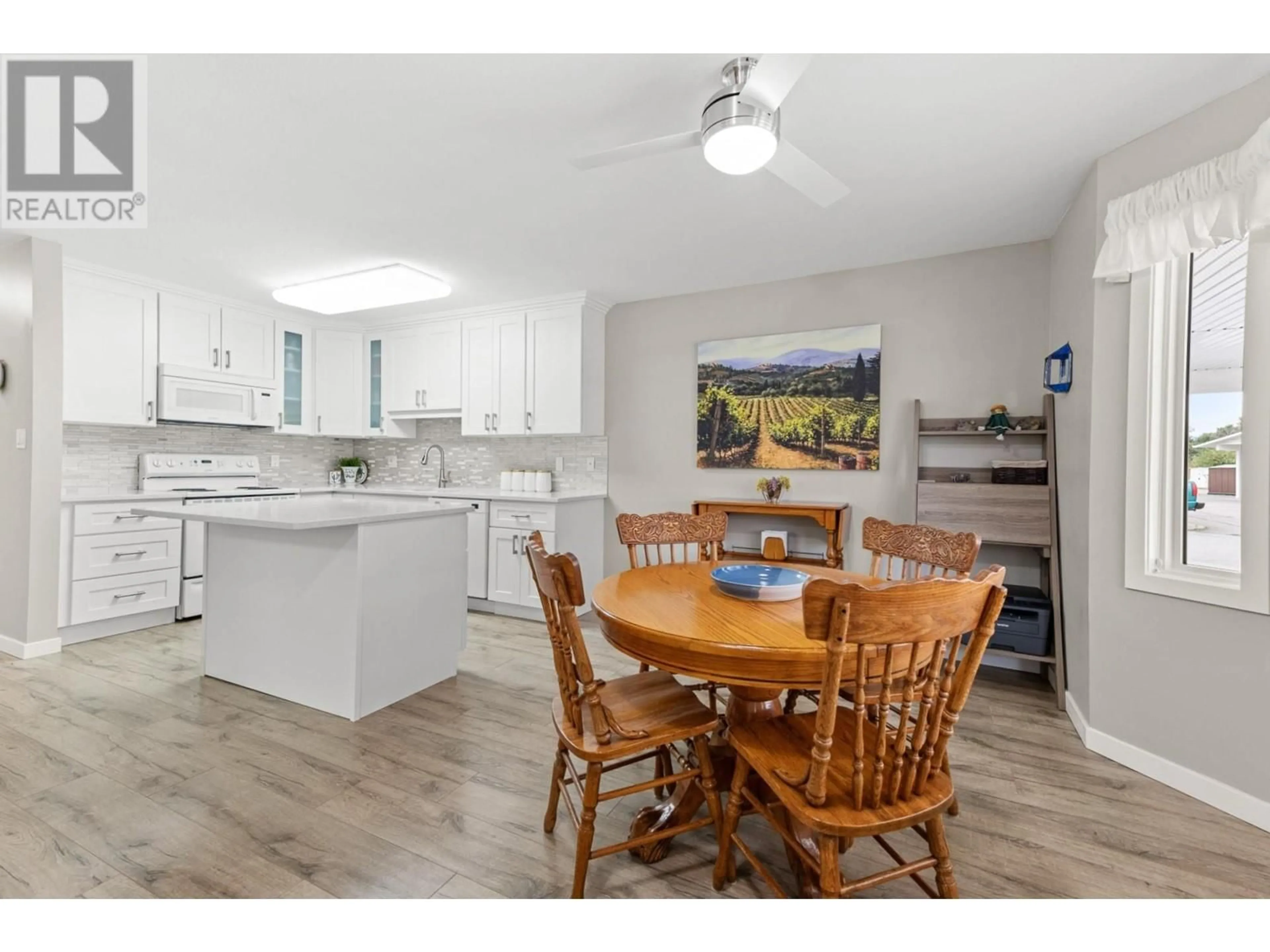 Open concept kitchen, wood/laminate floor for 2235 BASKIN Street Unit# 115, Penticton British Columbia V2A8A8