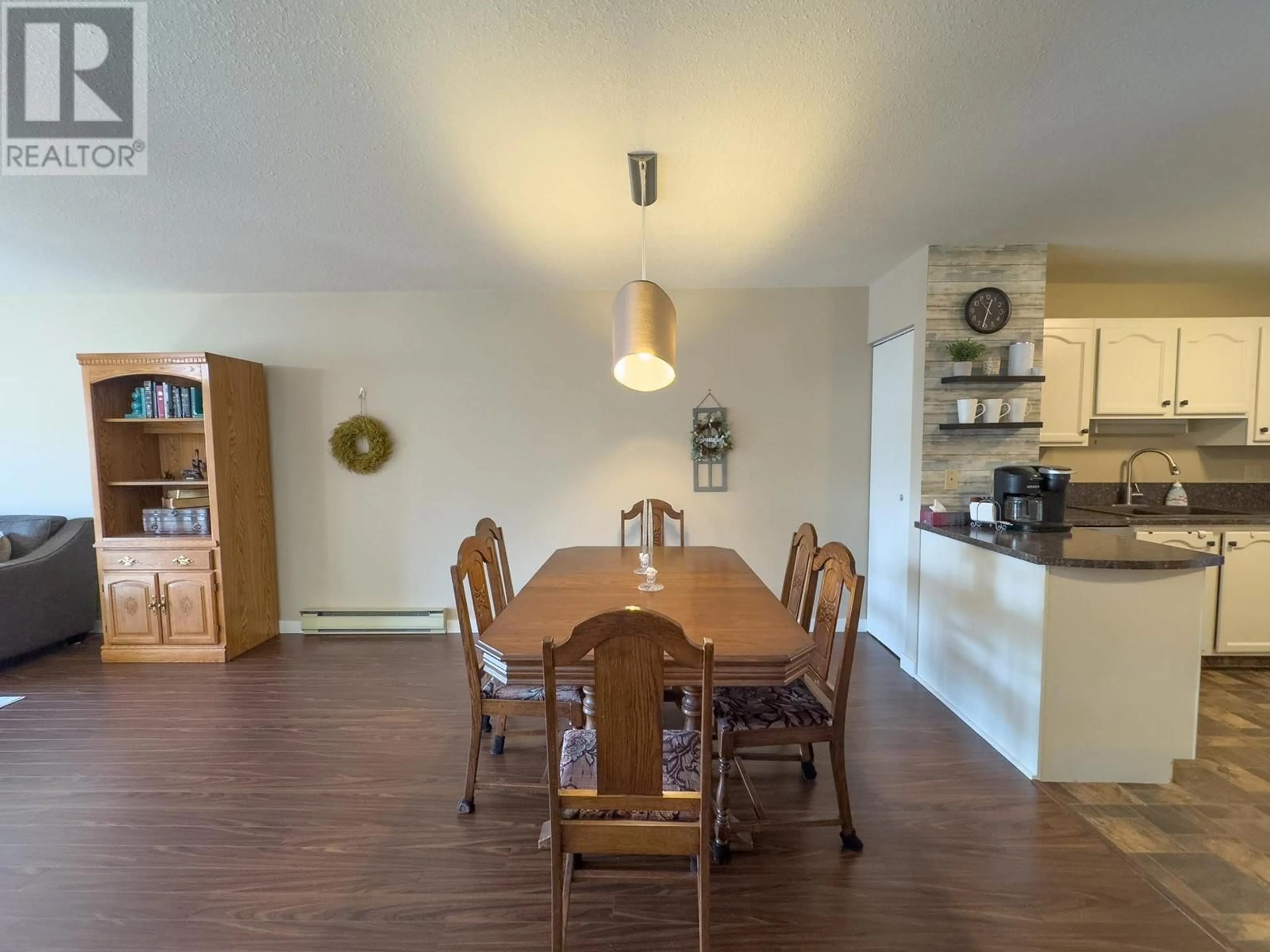 Dining room, wood/laminate floor for 1820 ATKINSON Street Unit# 207, Penticton British Columbia V2A7M6