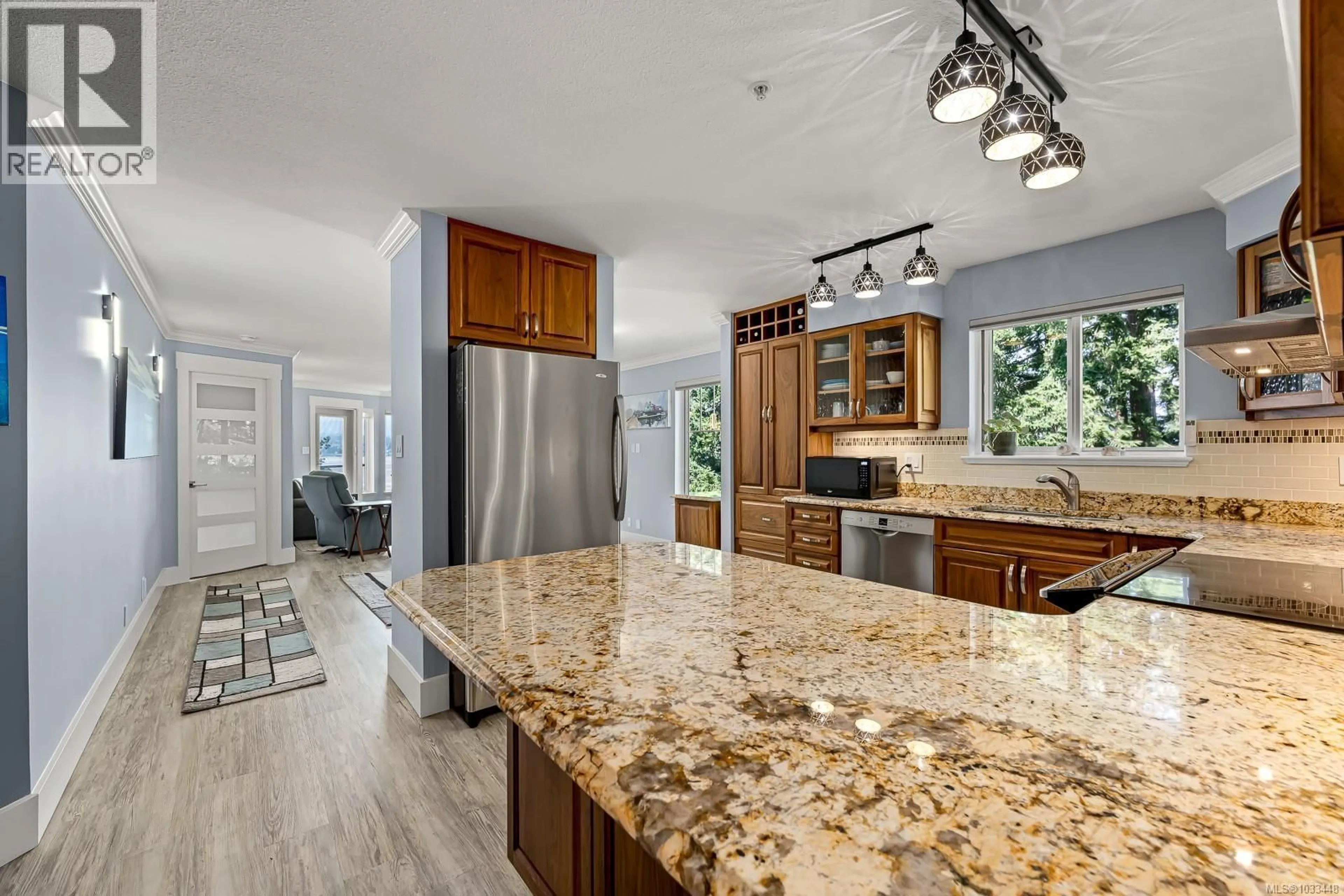 Open concept kitchen, ceramic/tile floor for 305 - 2275 COMOX AVENUE, Comox British Columbia V9M1X6