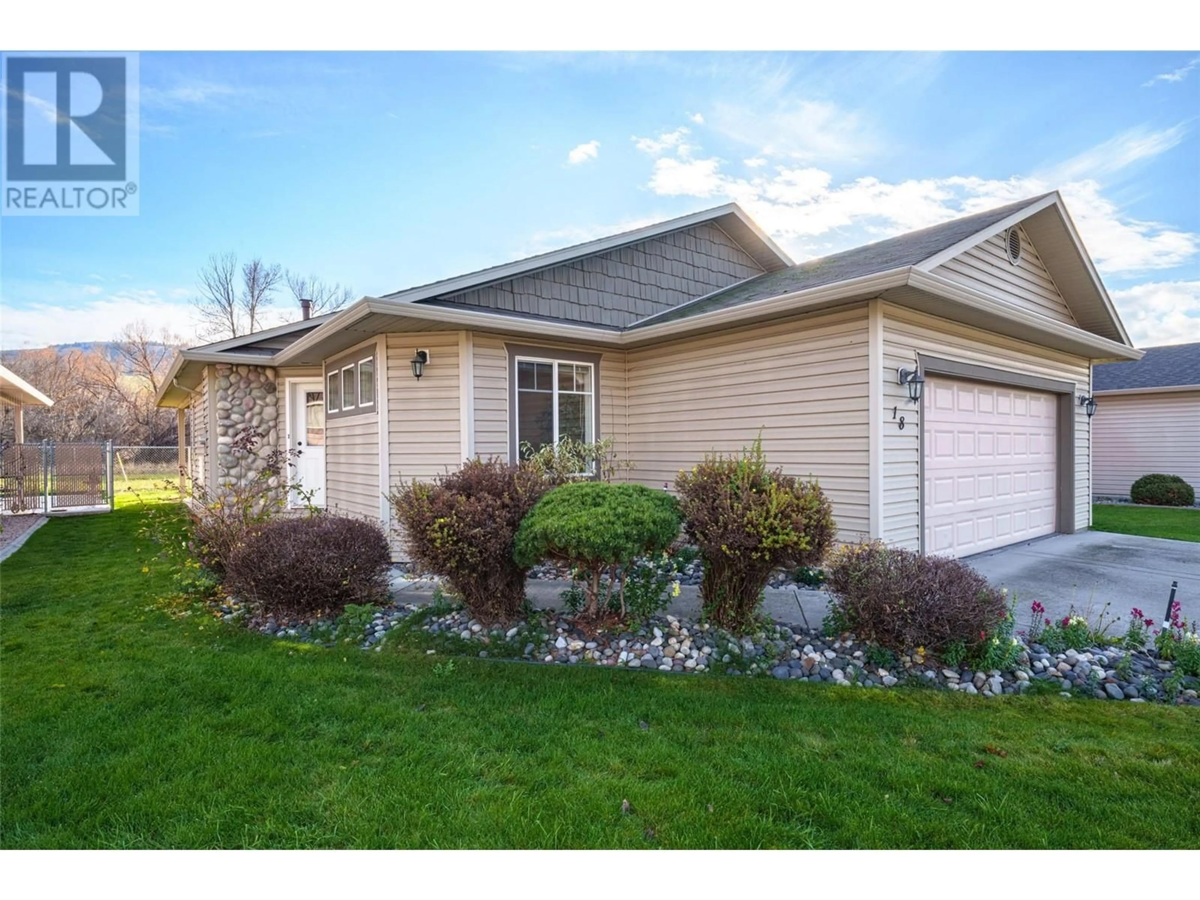 Home with vinyl exterior material, street for 5888 Okanagan Landing Road Unit# 18, Vernon British Columbia V1H1S2