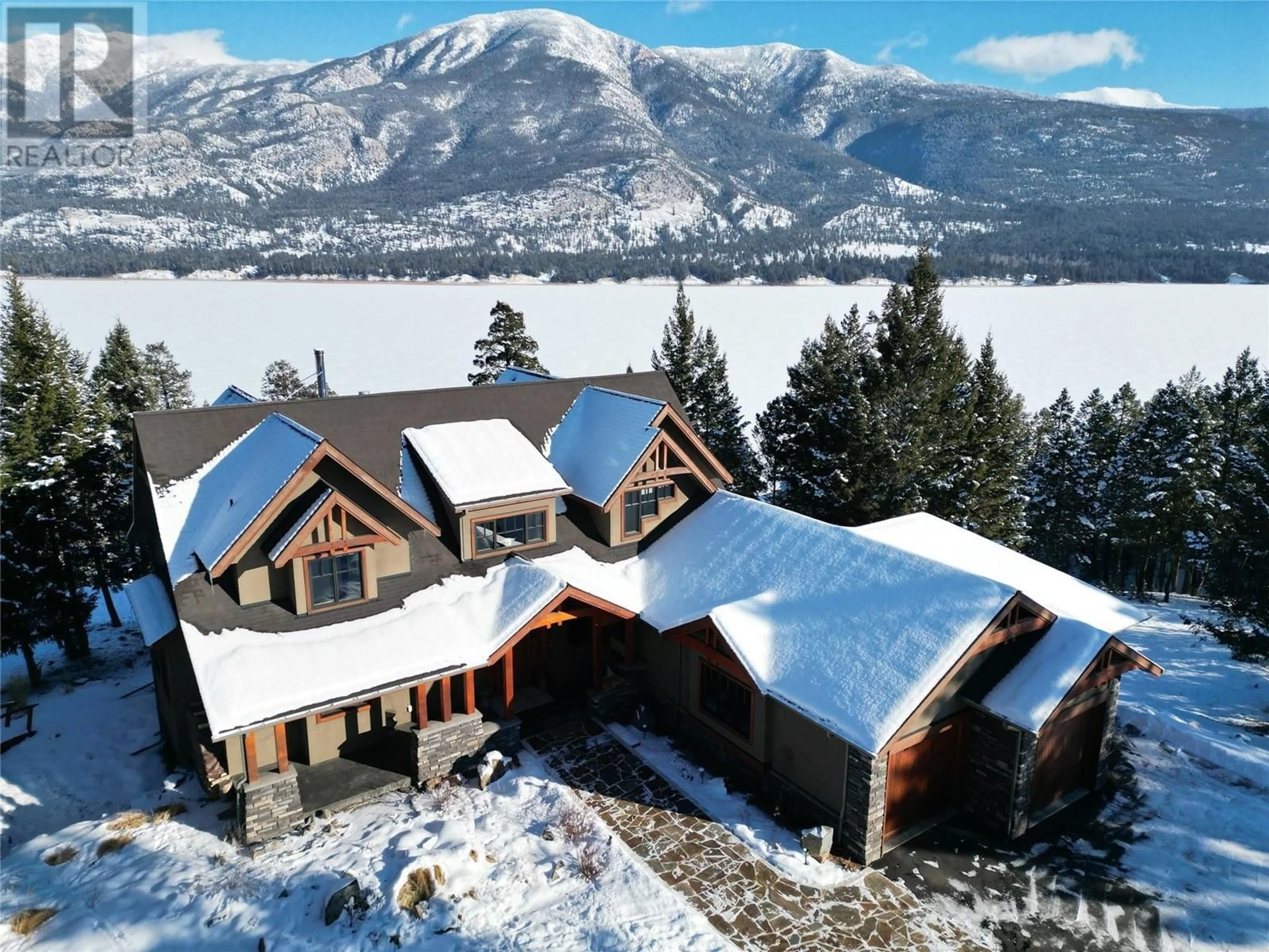 A pic from outside/outdoor area/front of a property/back of a property/a pic from drone, mountain view for 4487 FIR Bay, Fairmont Hot Springs British Columbia V0B1L2