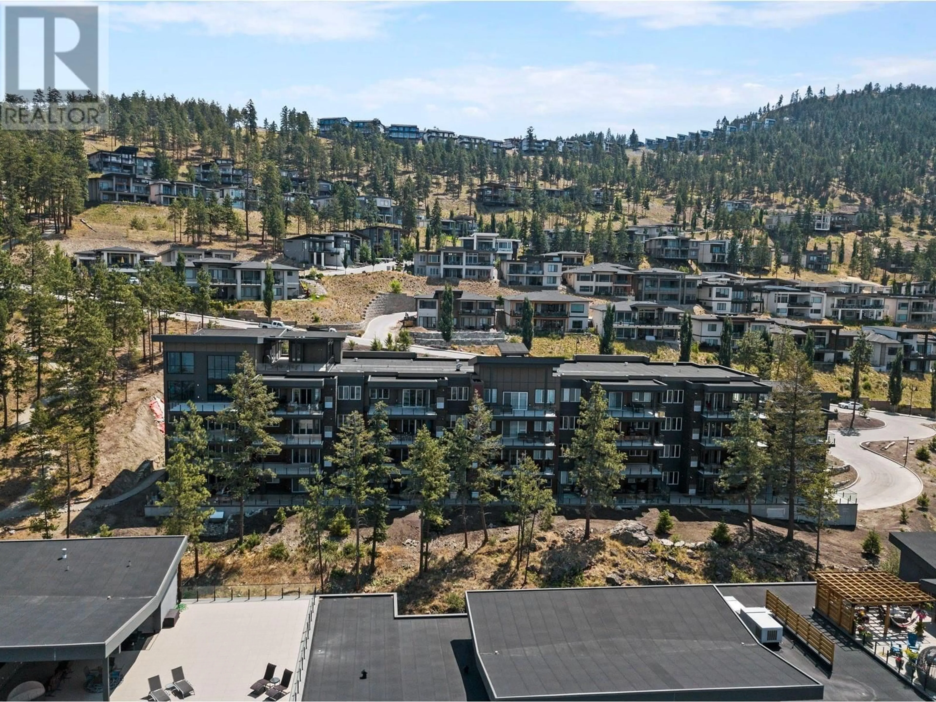 A pic from outside/outdoor area/front of a property/back of a property/a pic from drone, mountain view for 401 - 3475 GRANITE CLOSE, Kelowna British Columbia V1V0B9