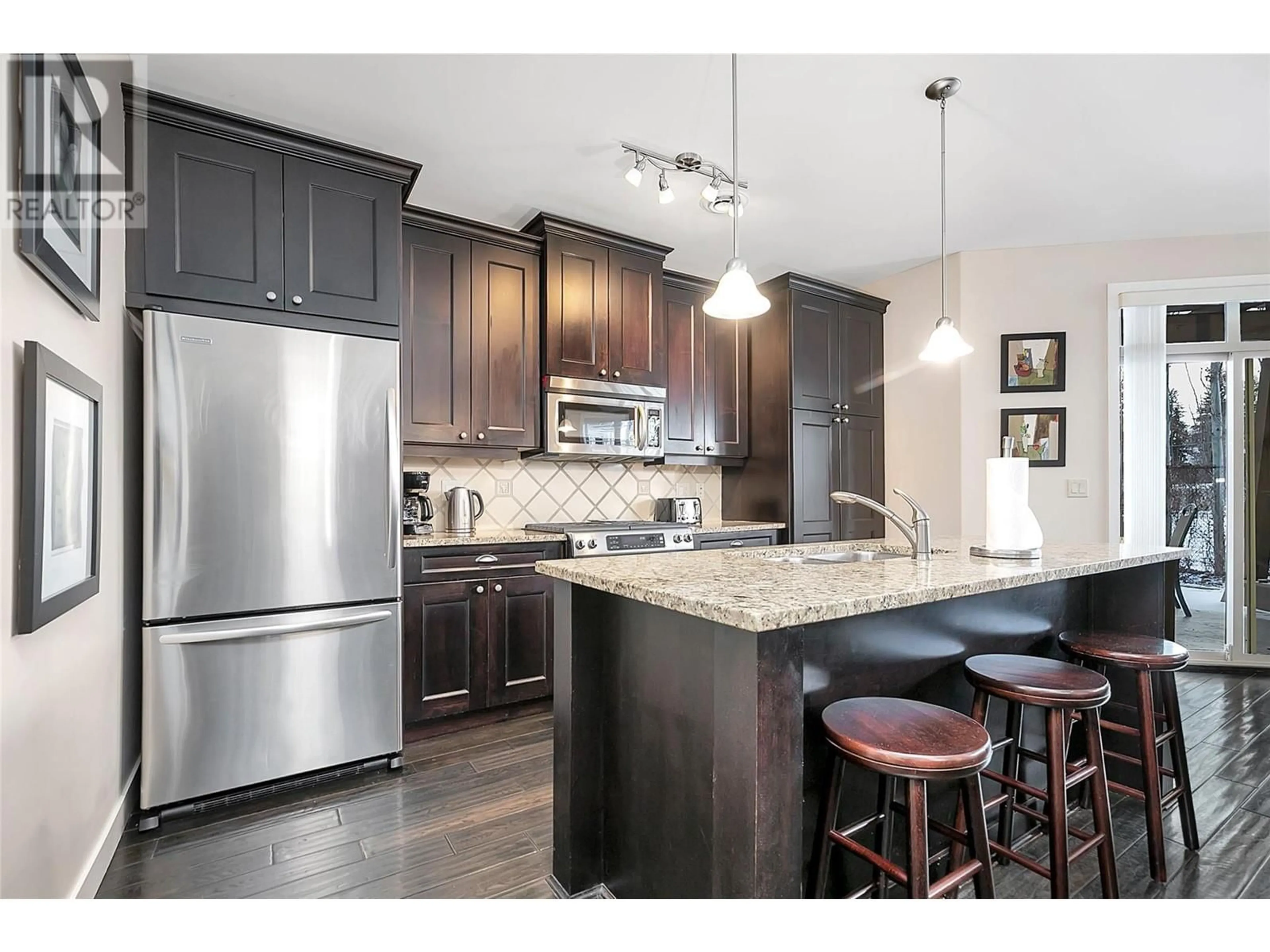 Open concept kitchen, wood/laminate floor for 4036 Pritchard Drive N Unit# 3101, West Kelowna British Columbia V4T3E4