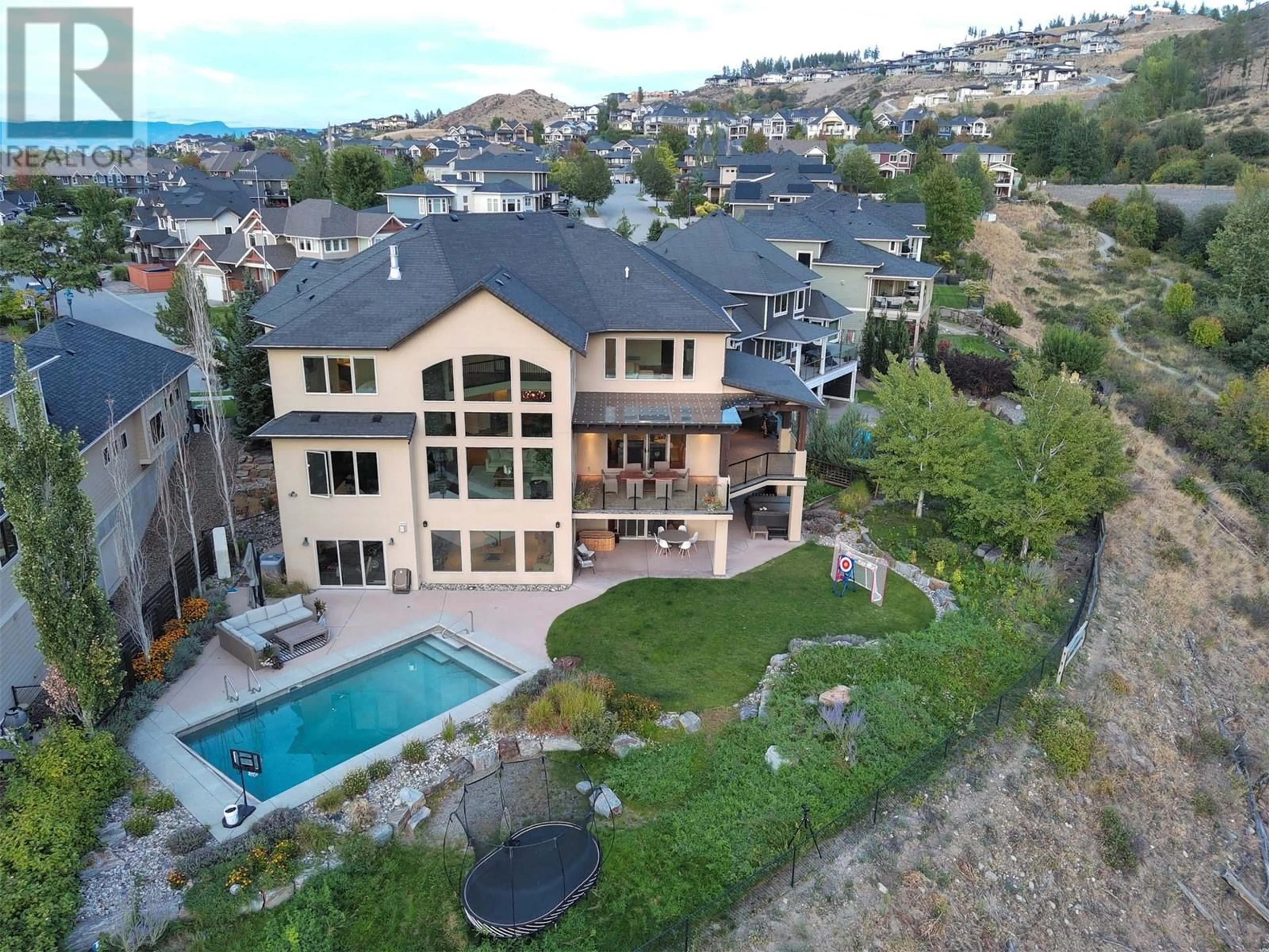 A pic from outside/outdoor area/front of a property/back of a property/a pic from drone, mountain view for 373 Farron Court, Kelowna British Columbia V1W5H2