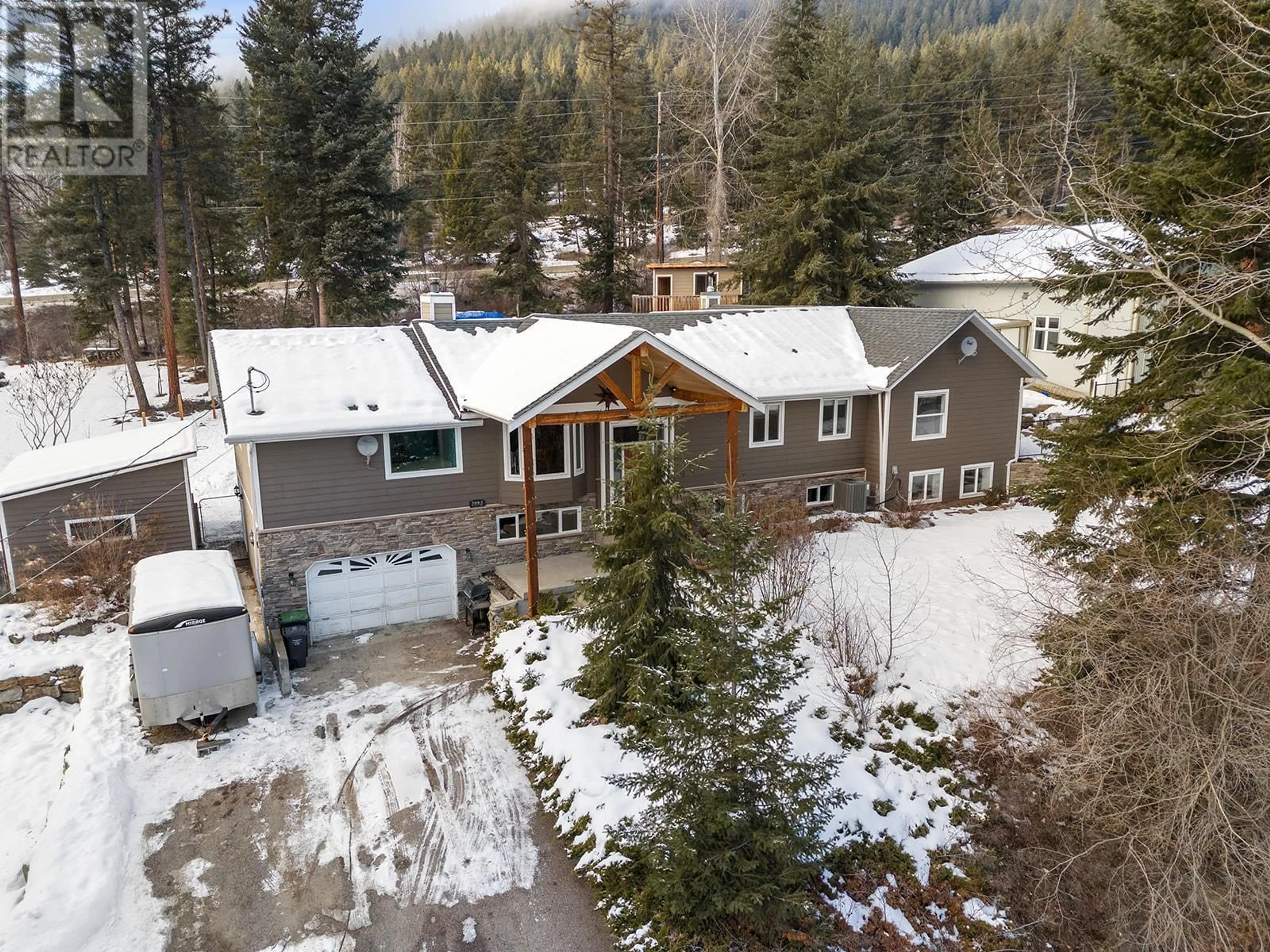 A pic from outside/outdoor area/front of a property/back of a property/a pic from drone, mountain view for 7992 FALCON RIDGE CRESCENT, Kelowna British Columbia V1P1J2