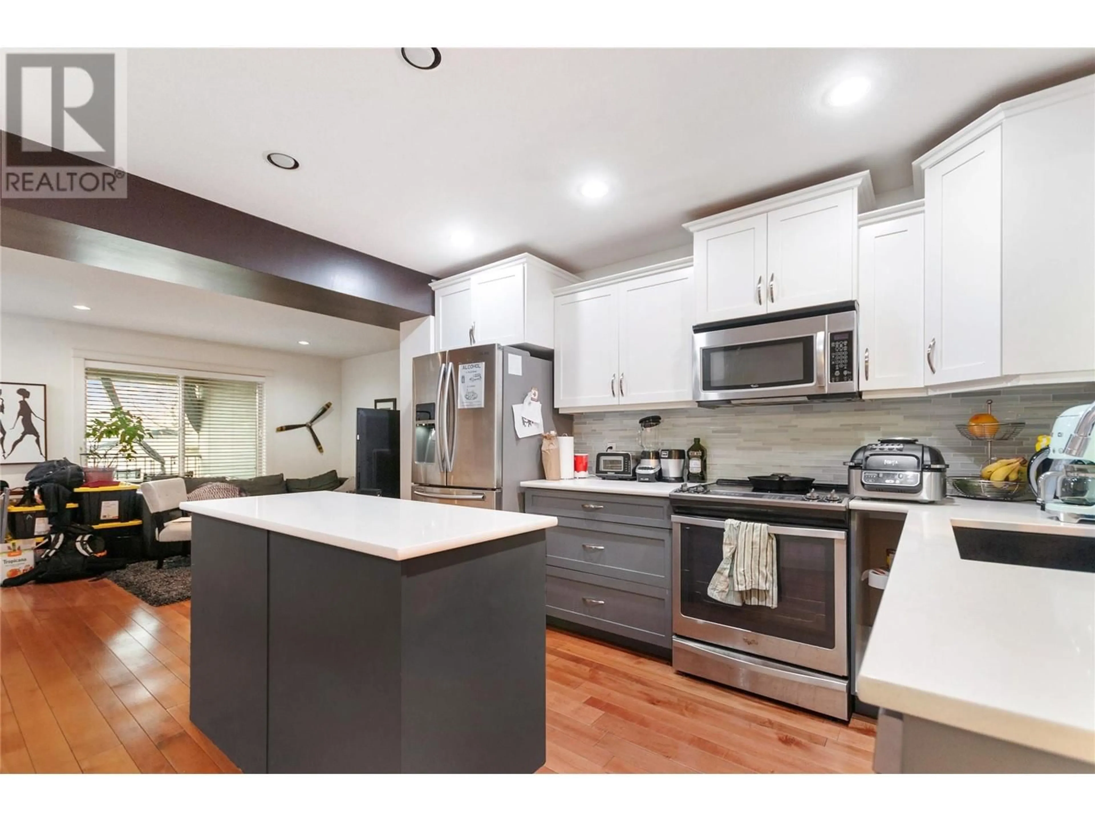 Open concept kitchen, wood/laminate floor for 741 CLEMENT AVENUE, Kelowna British Columbia V1Y7C9