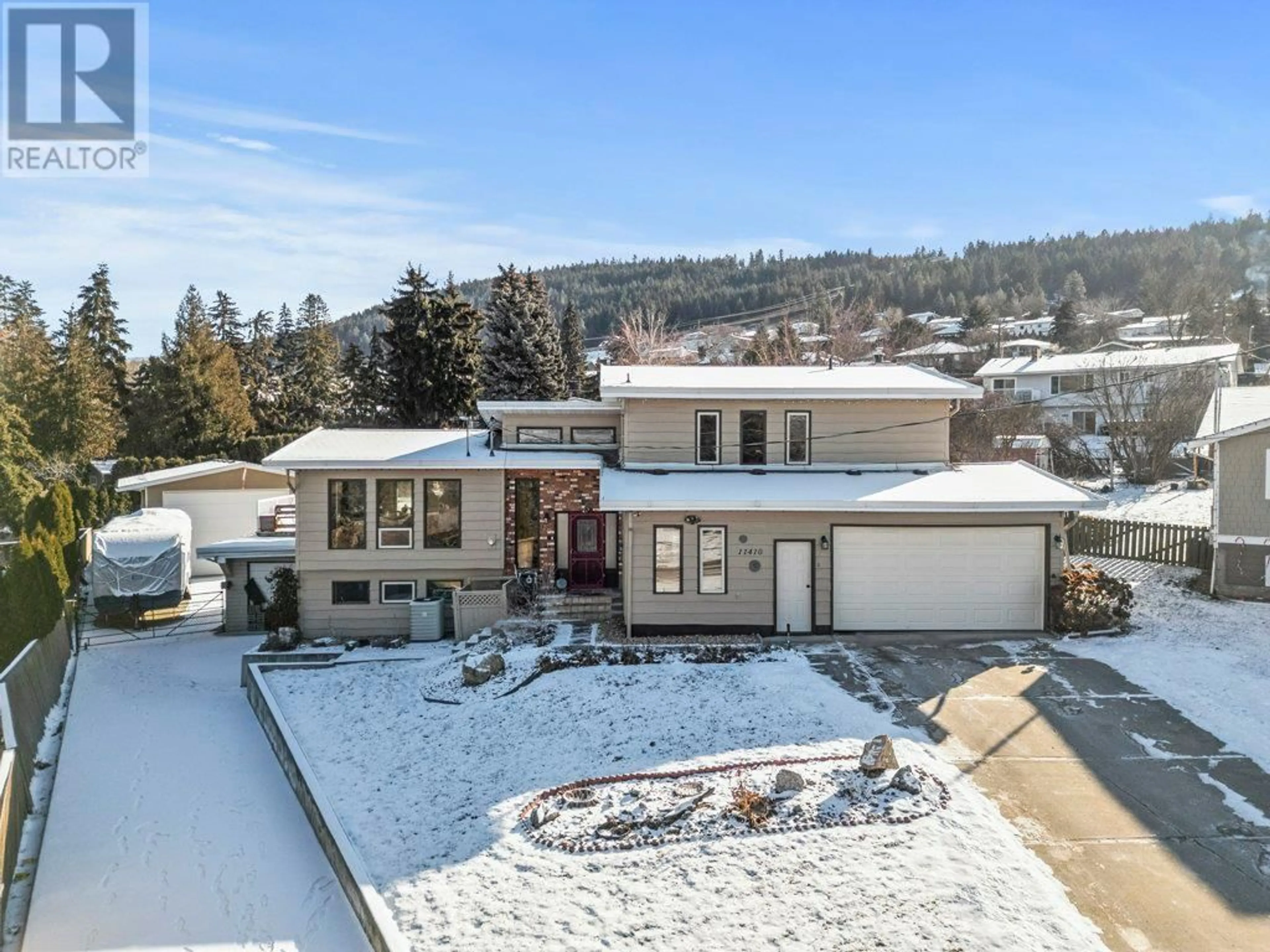 A pic from outside/outdoor area/front of a property/back of a property/a pic from drone, street for 11410 Tassie Drive, Coldstream British Columbia V1B1H4