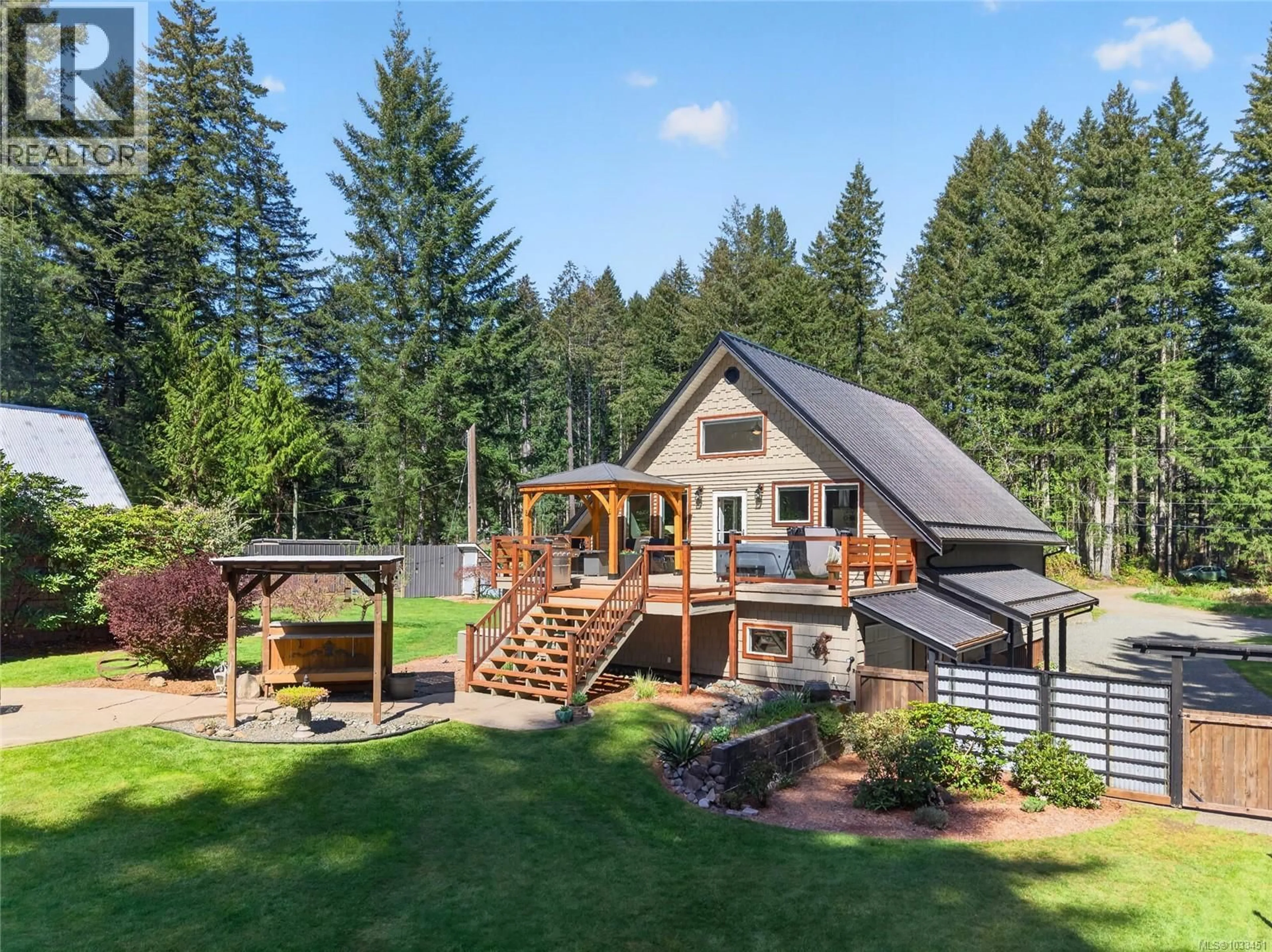 A pic from outside/outdoor area/front of a property/back of a property/a pic from drone, mountain view for 1981 DZINI ROAD, Black Creek British Columbia V9J1H1
