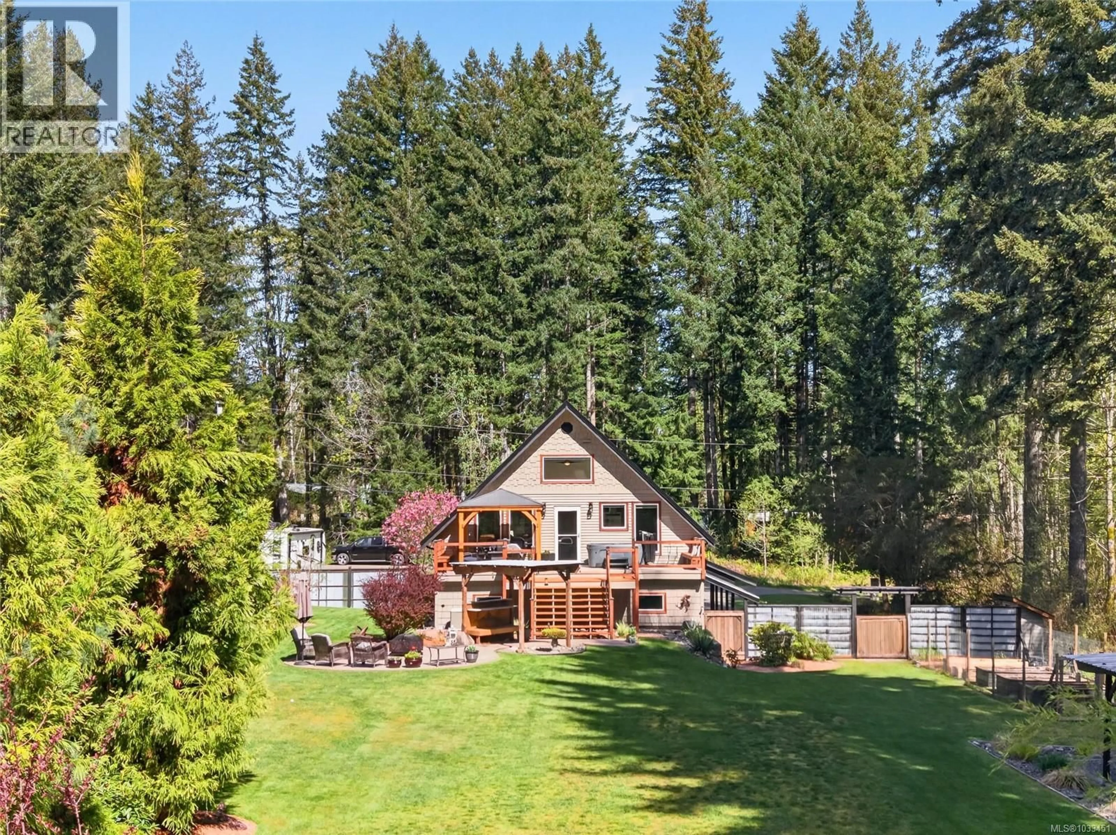 A pic from outside/outdoor area/front of a property/back of a property/a pic from drone, forest/trees view for 1981 DZINI ROAD, Black Creek British Columbia V9J1H1