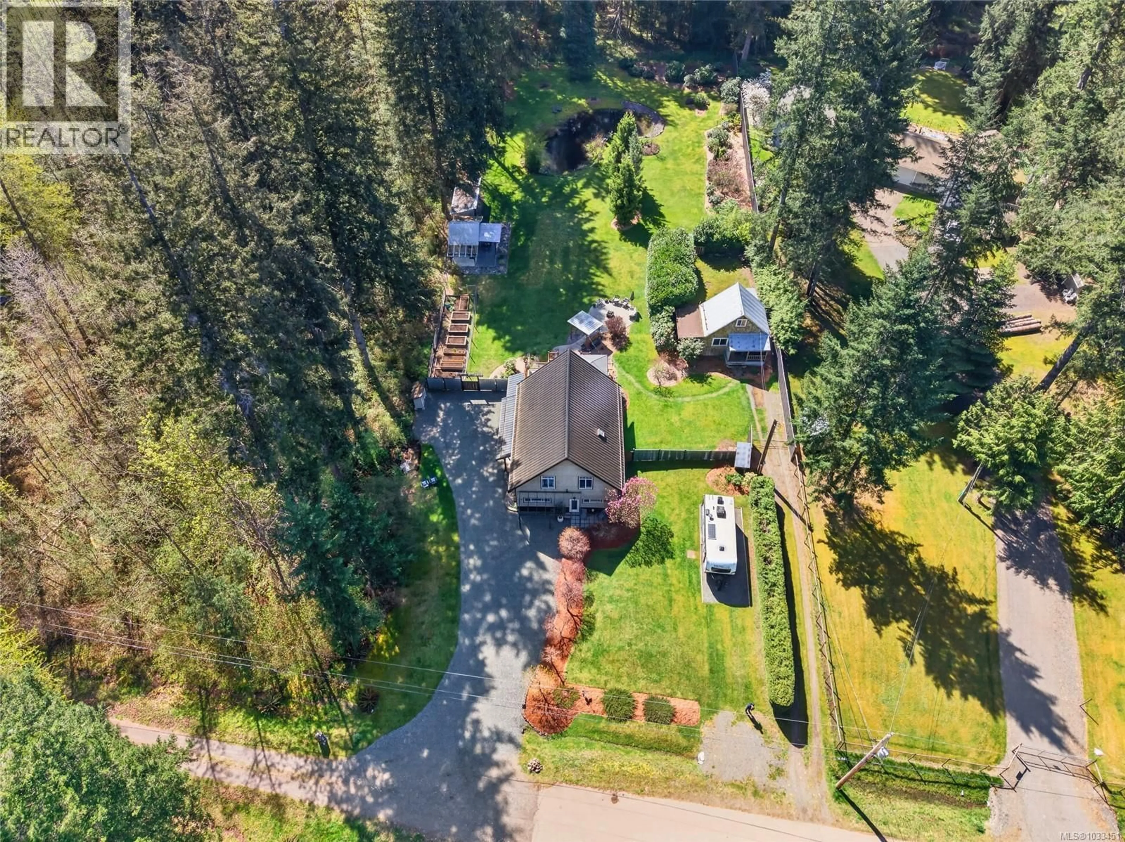 A pic from outside/outdoor area/front of a property/back of a property/a pic from drone, unknown for 1981 DZINI ROAD, Black Creek British Columbia V9J1H1