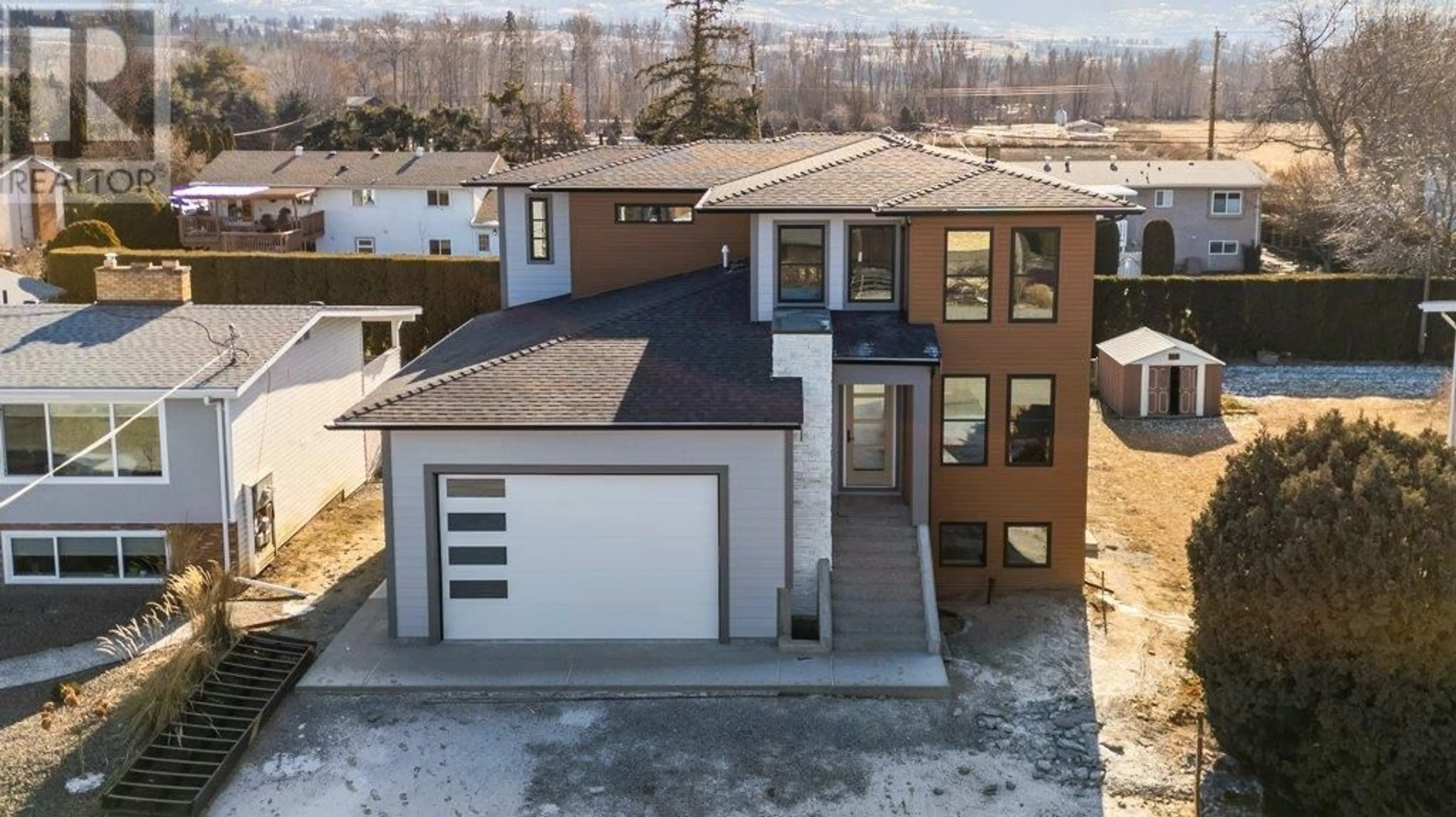 A pic from outside/outdoor area/front of a property/back of a property/a pic from drone, street for 2015 Polo Road, Kelowna British Columbia V1W2H5