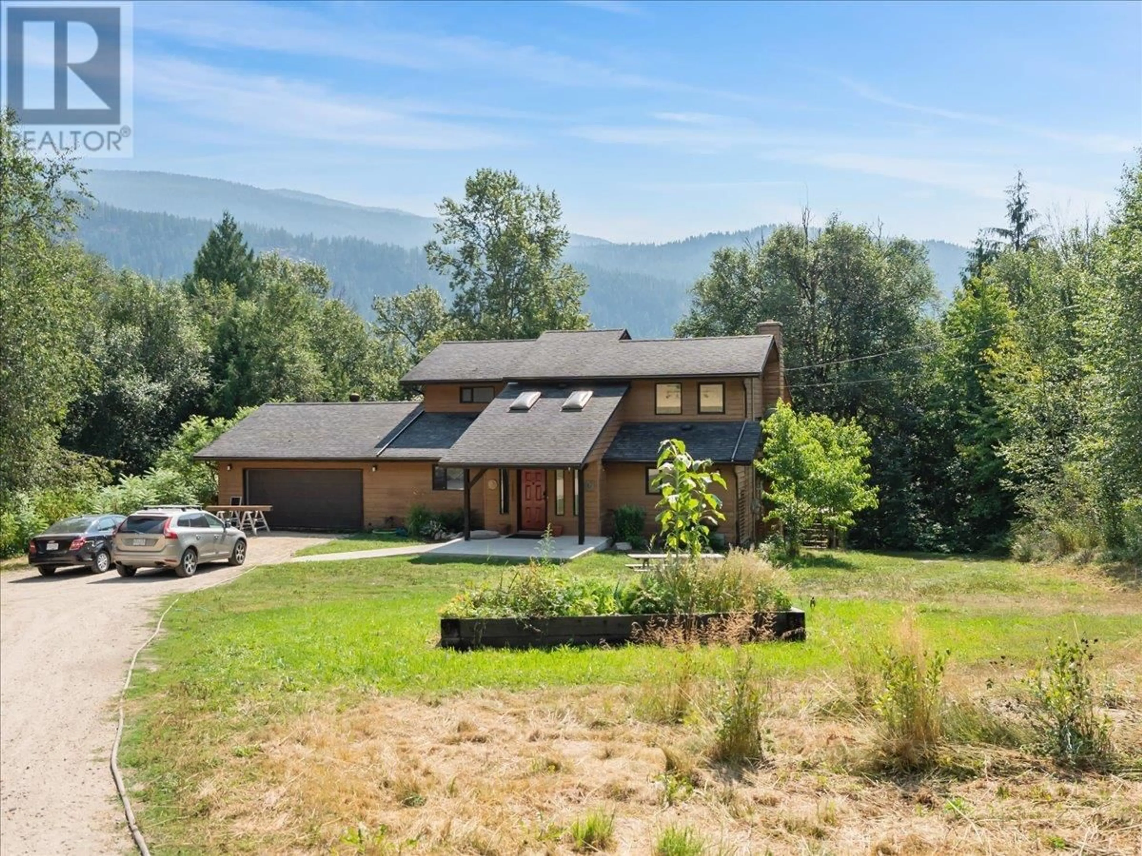 A pic from outside/outdoor area/front of a property/back of a property/a pic from drone, mountain view for 6172 SLOCAN RIVER Road, Winlaw British Columbia V0G2J0