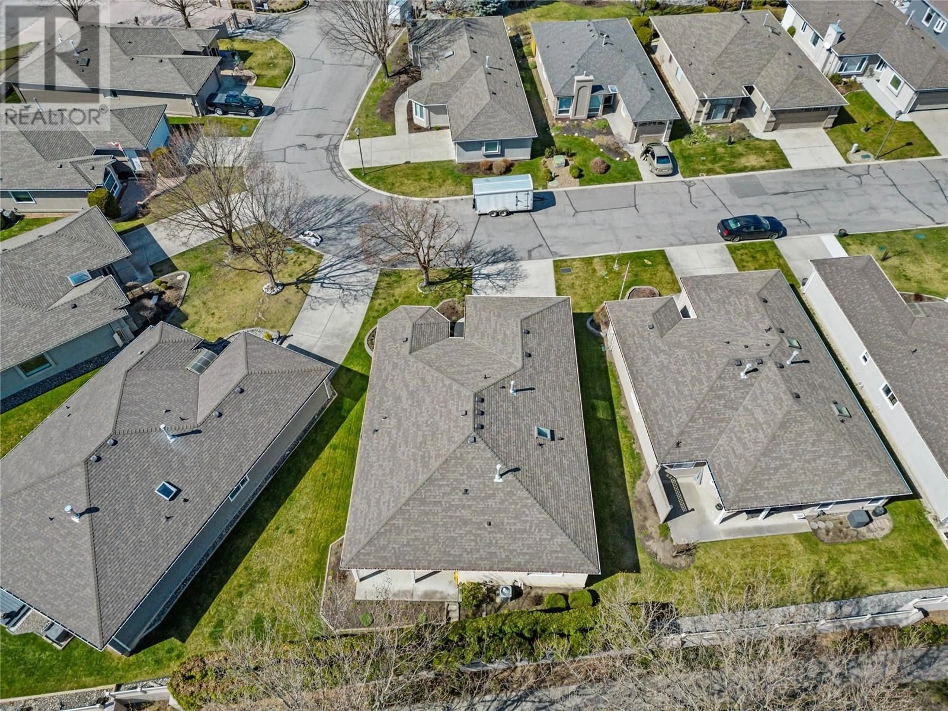 A pic from outside/outdoor area/front of a property/back of a property/a pic from drone, street for 75 - 615 GLENMEADOWS ROAD, Kelowna British Columbia V1V1N9