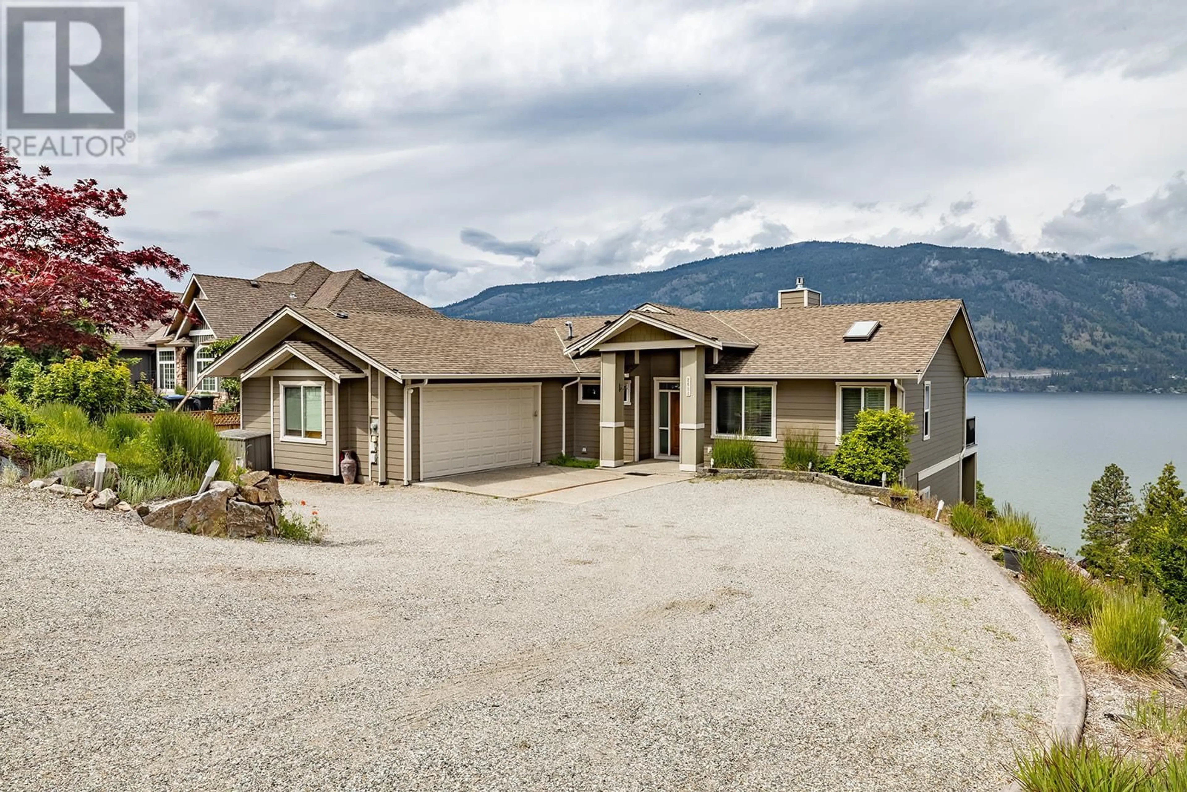 A pic from outside/outdoor area/front of a property/back of a property/a pic from drone, mountain view for 2688 Arthur Road, Kelowna British Columbia V1V2B7