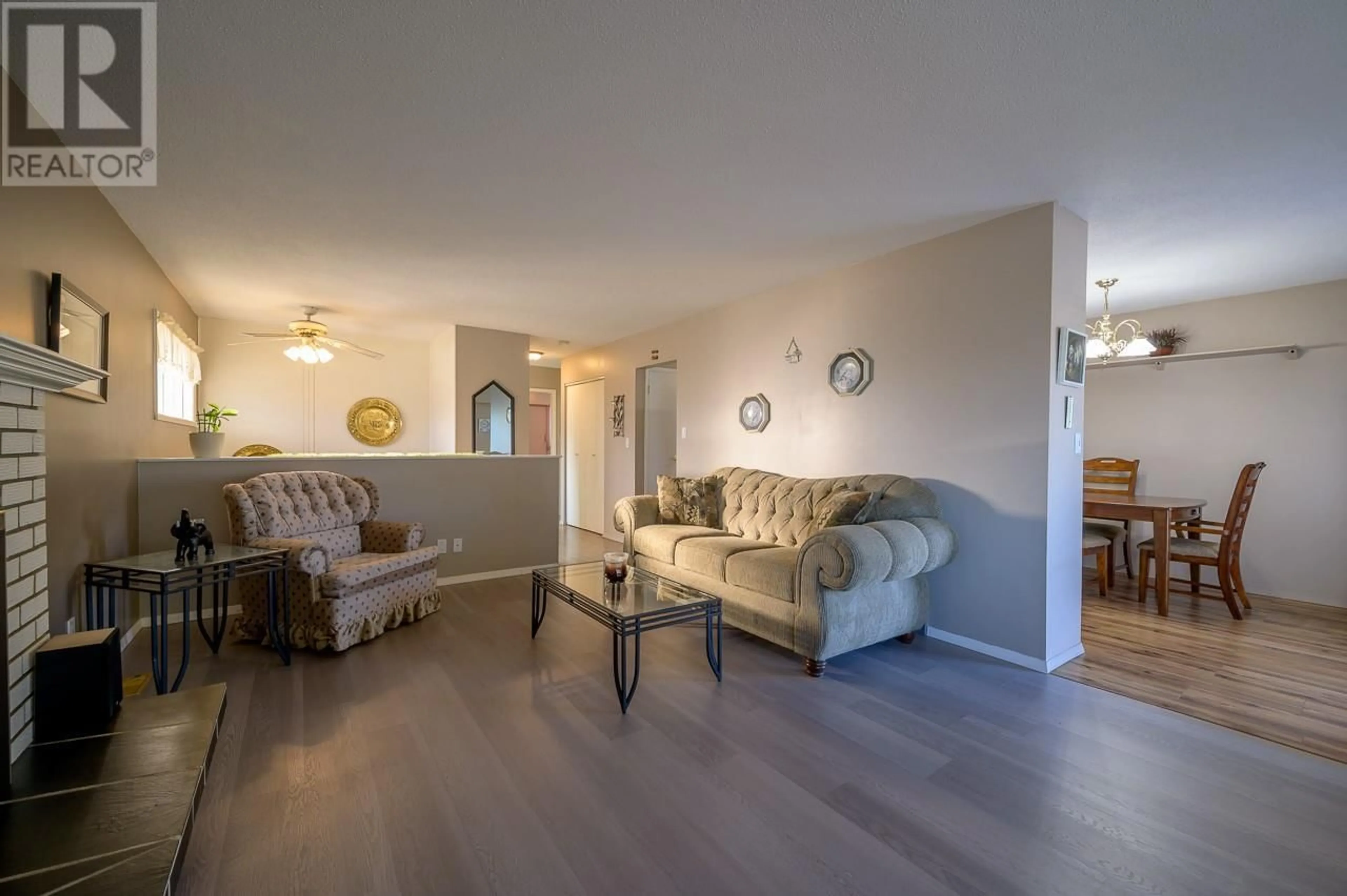 Living room with furniture, wood/laminate floor for 1020 Holt Street, Kamloops British Columbia V2B5H2