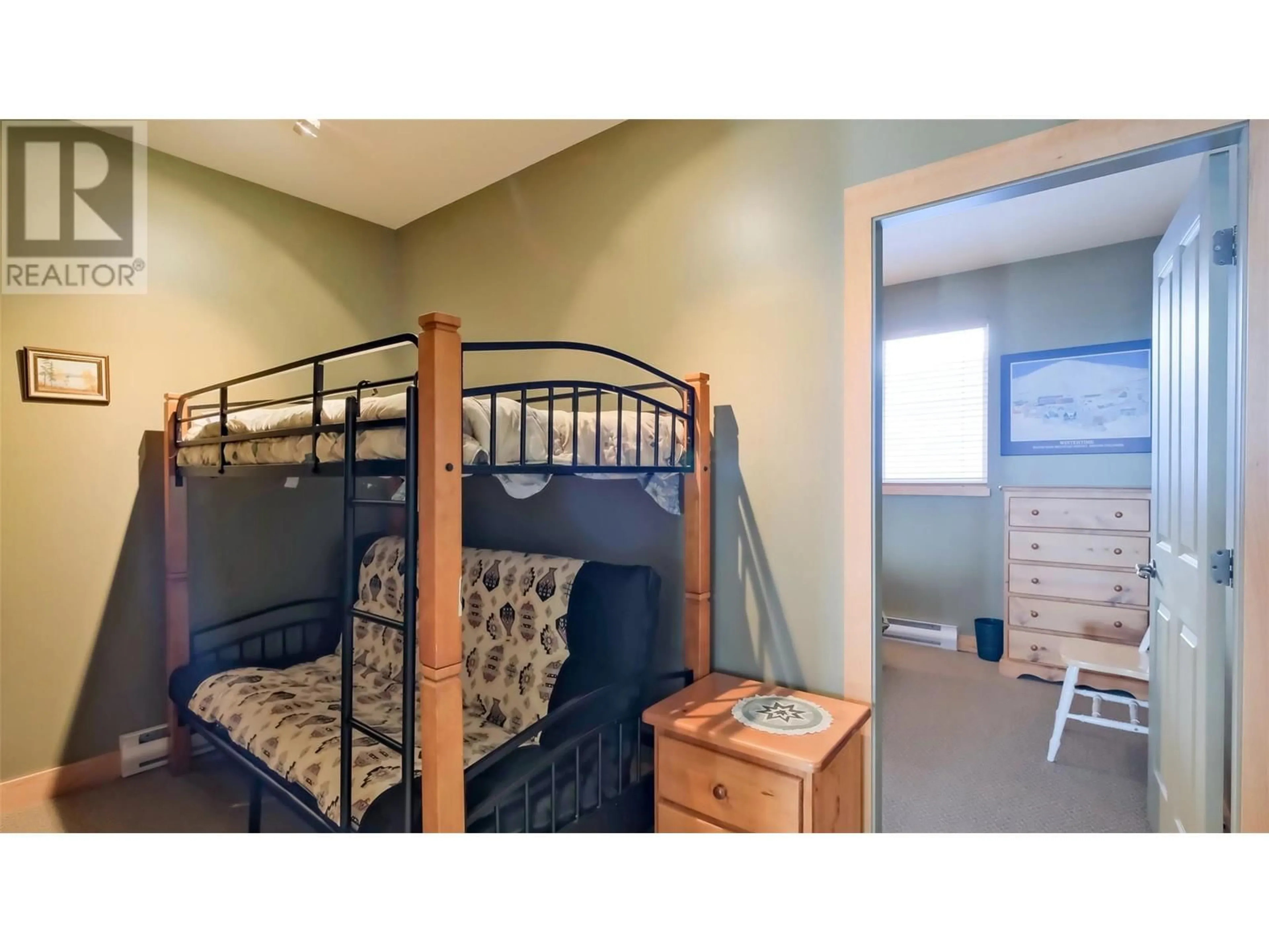 Bedroom with bed, wood/laminate floor for 7650 Porcupine Road Unit# 2, Big White British Columbia V1P1P3