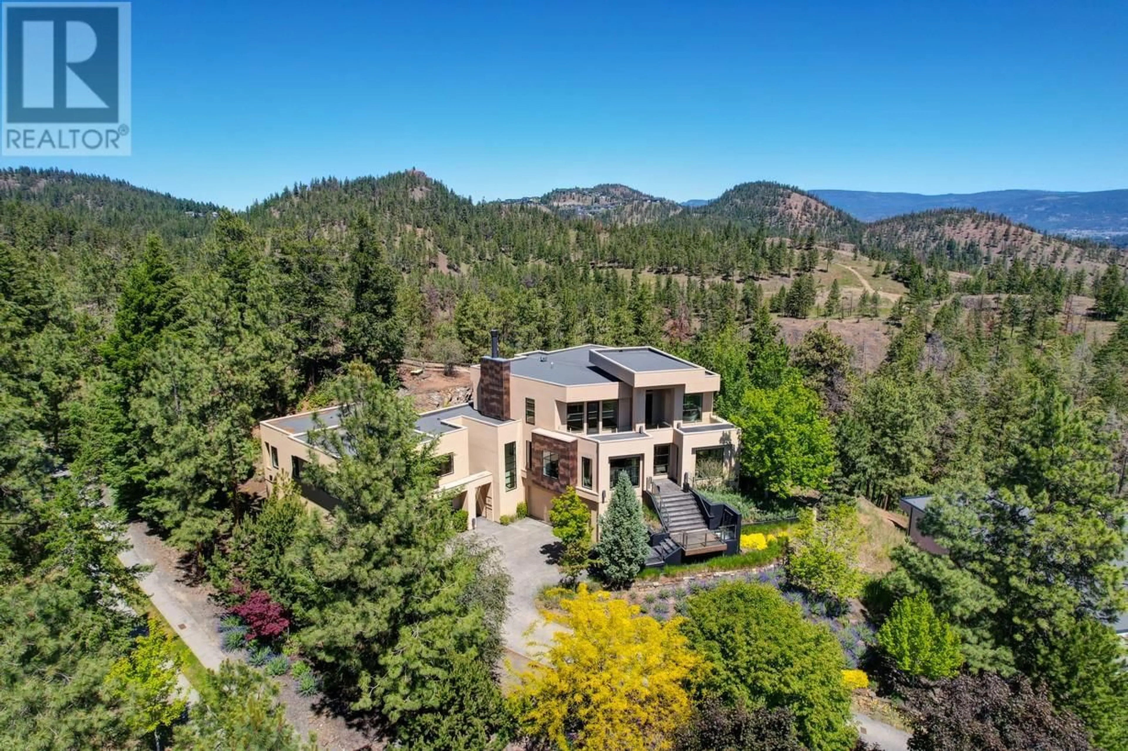 A pic from outside/outdoor area/front of a property/back of a property/a pic from drone, mountain view for 1180 STONEYPOINTE COURT, Kelowna British Columbia V1V2Y3