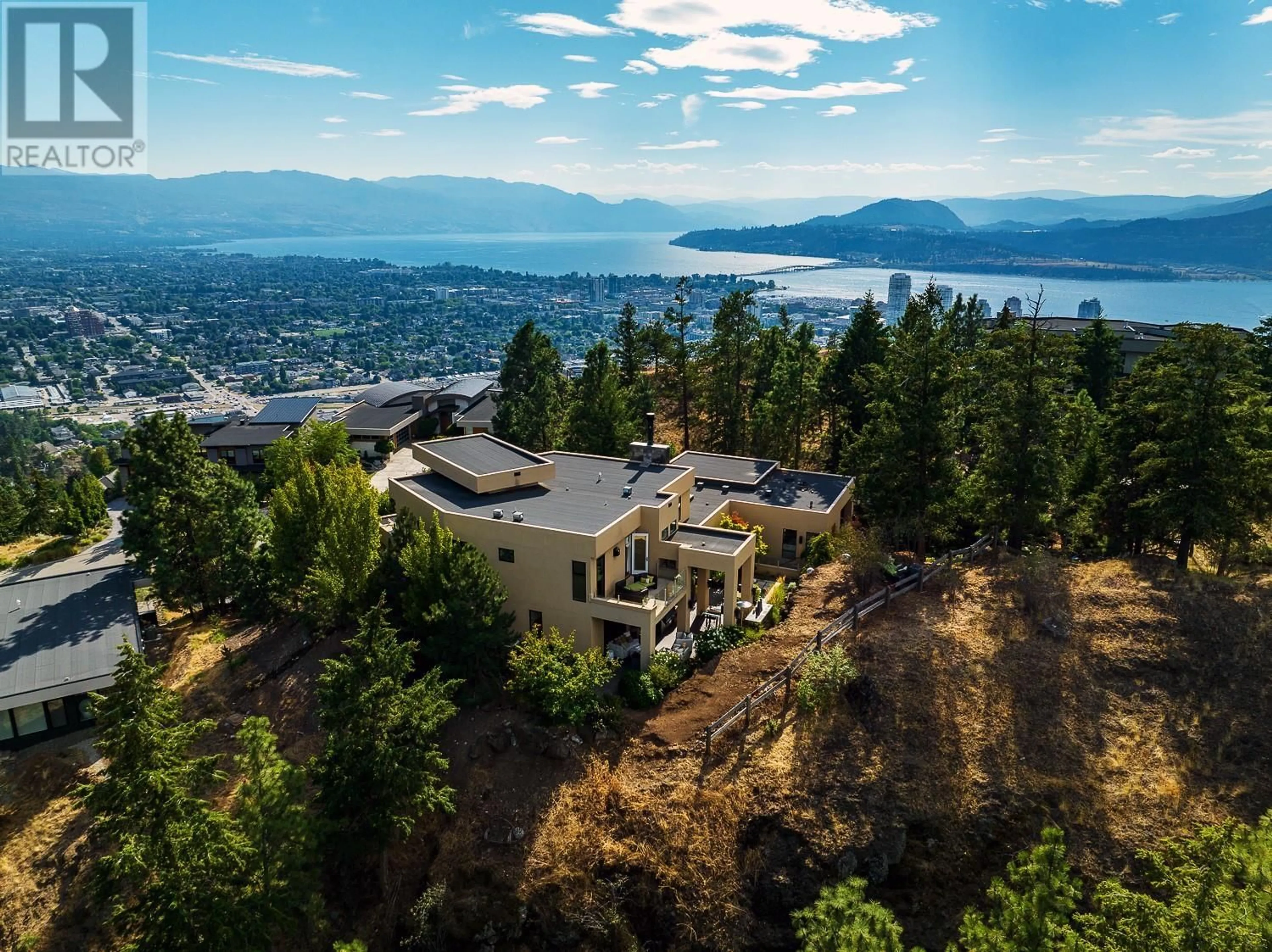 A pic from outside/outdoor area/front of a property/back of a property/a pic from drone, mountain view for 1180 Stoneypointe Court, Kelowna British Columbia V1V2Y3