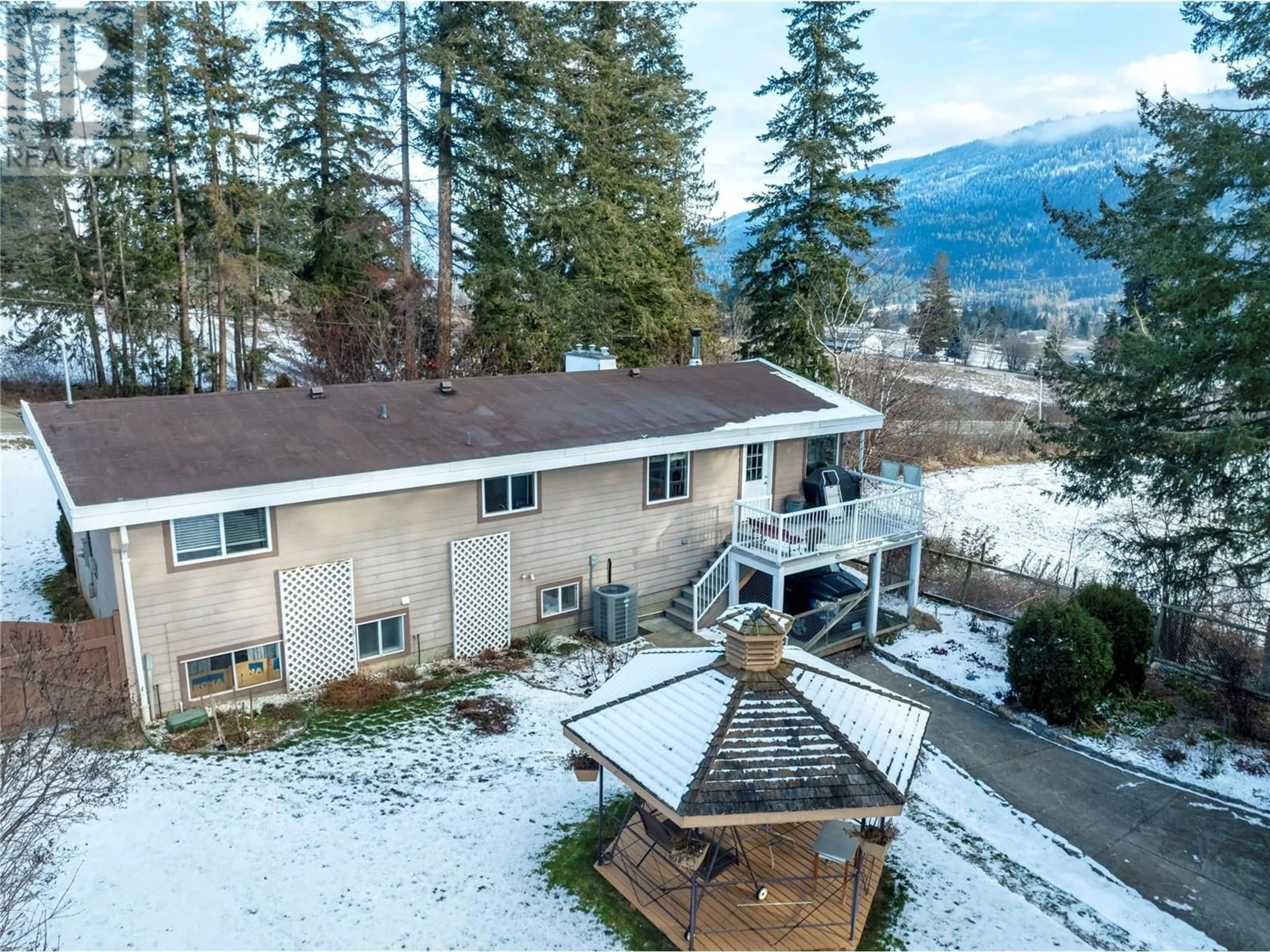 A pic from outside/outdoor area/front of a property/back of a property/a pic from drone, mountain view for 3740 20 Avenue NE, Salmon Arm British Columbia V1E1Z3