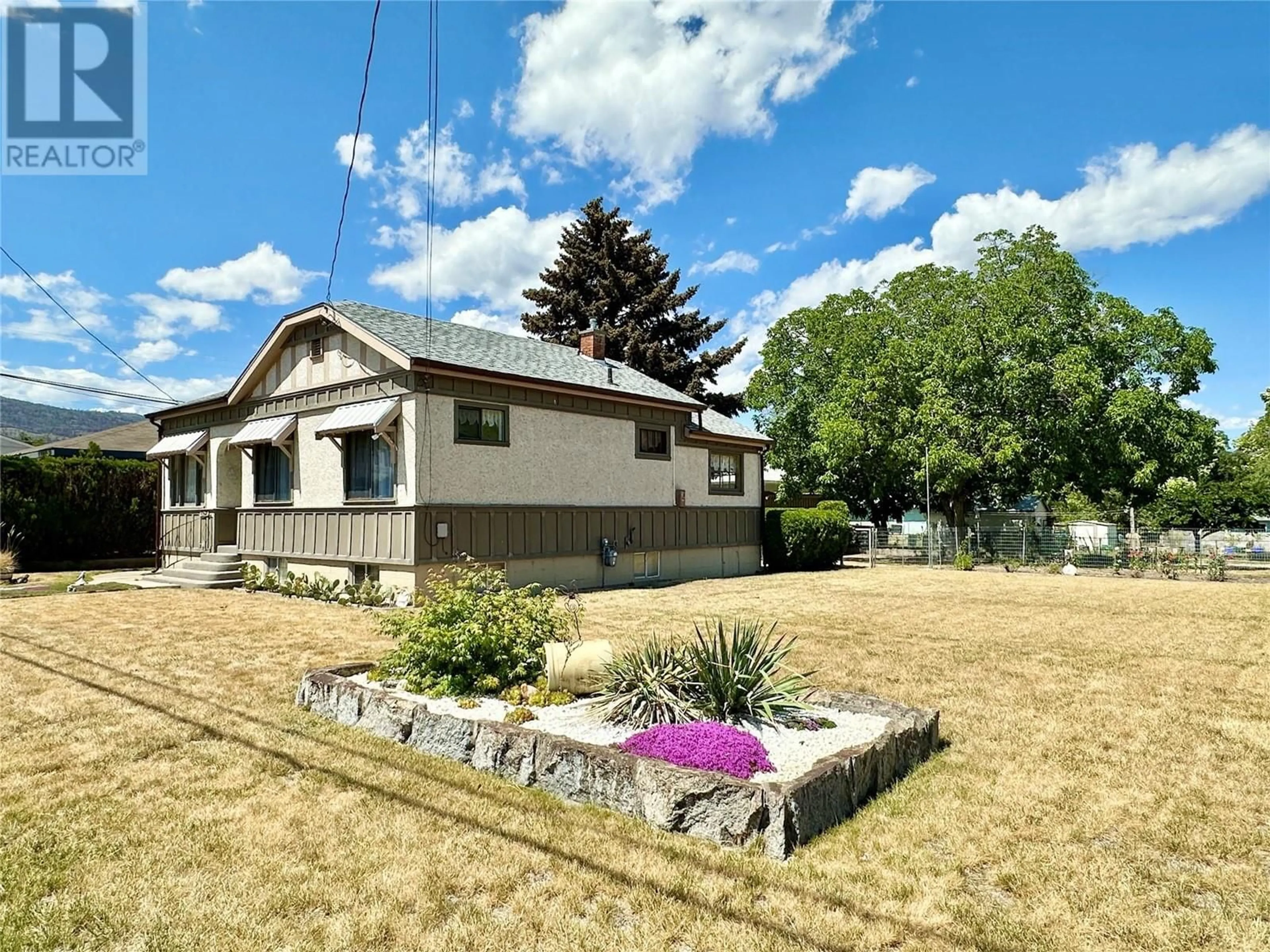 A pic from outside/outdoor area/front of a property/back of a property/a pic from drone, street for 8502 78TH Avenue, Osoyoos British Columbia V0H1V0