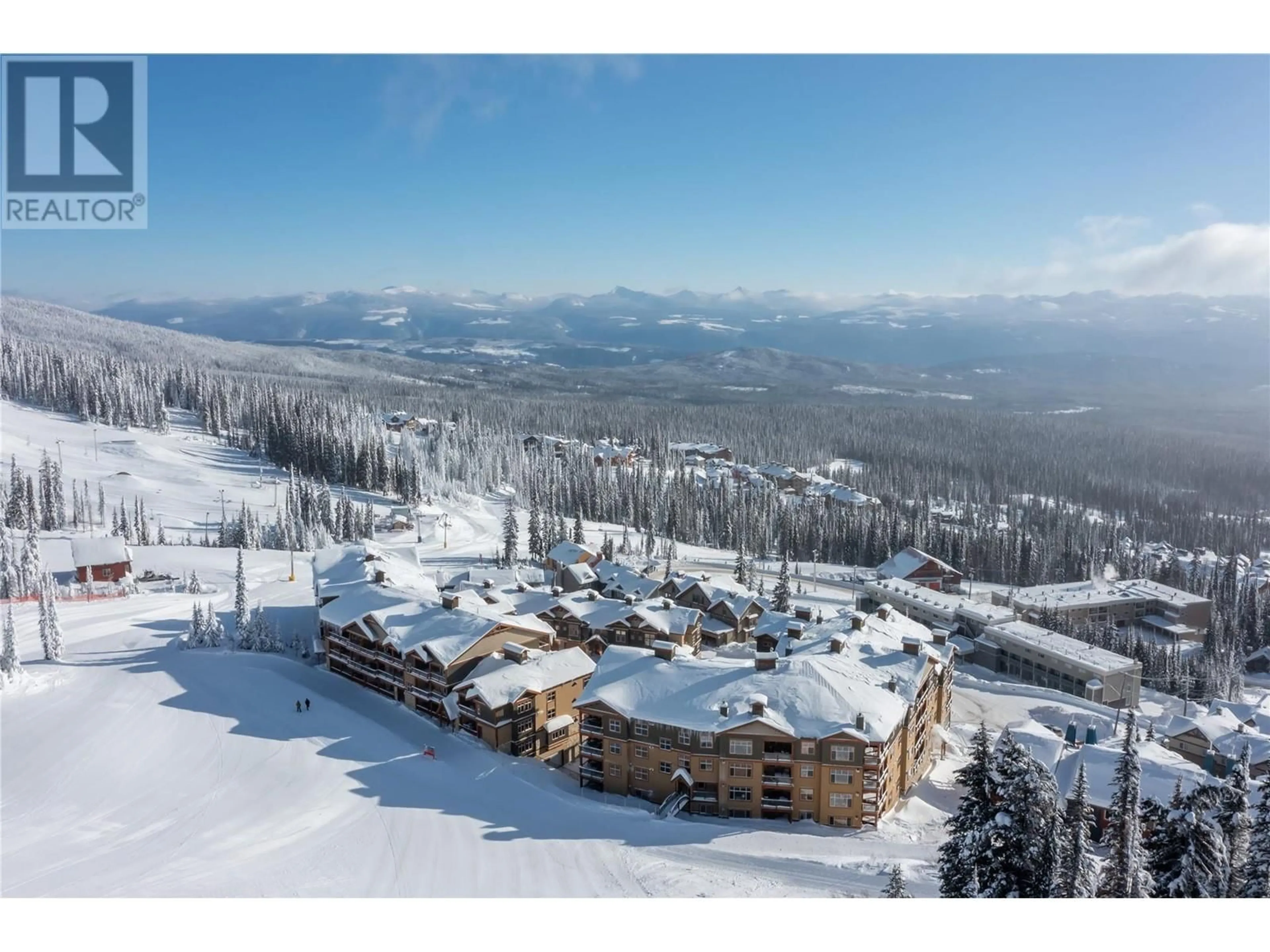 A pic from outside/outdoor area/front of a property/back of a property/a pic from drone, mountain view for 7700 Porcupine Road Unit# 3-104, Big White British Columbia V1P1P3