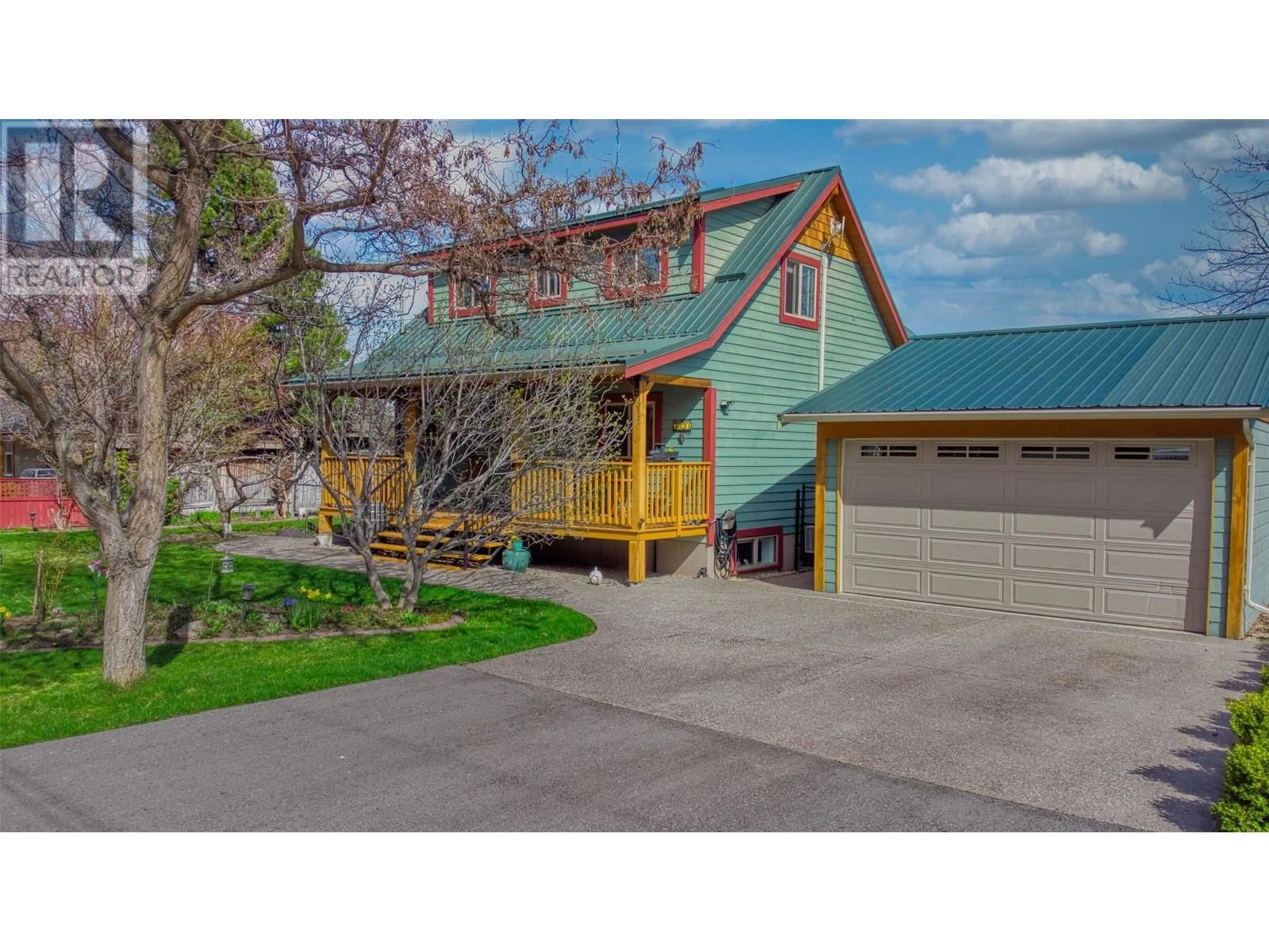 Home with vinyl exterior material, street for 7331 FINTRY DELTA ROAD, Kelowna British Columbia V1Z3R8