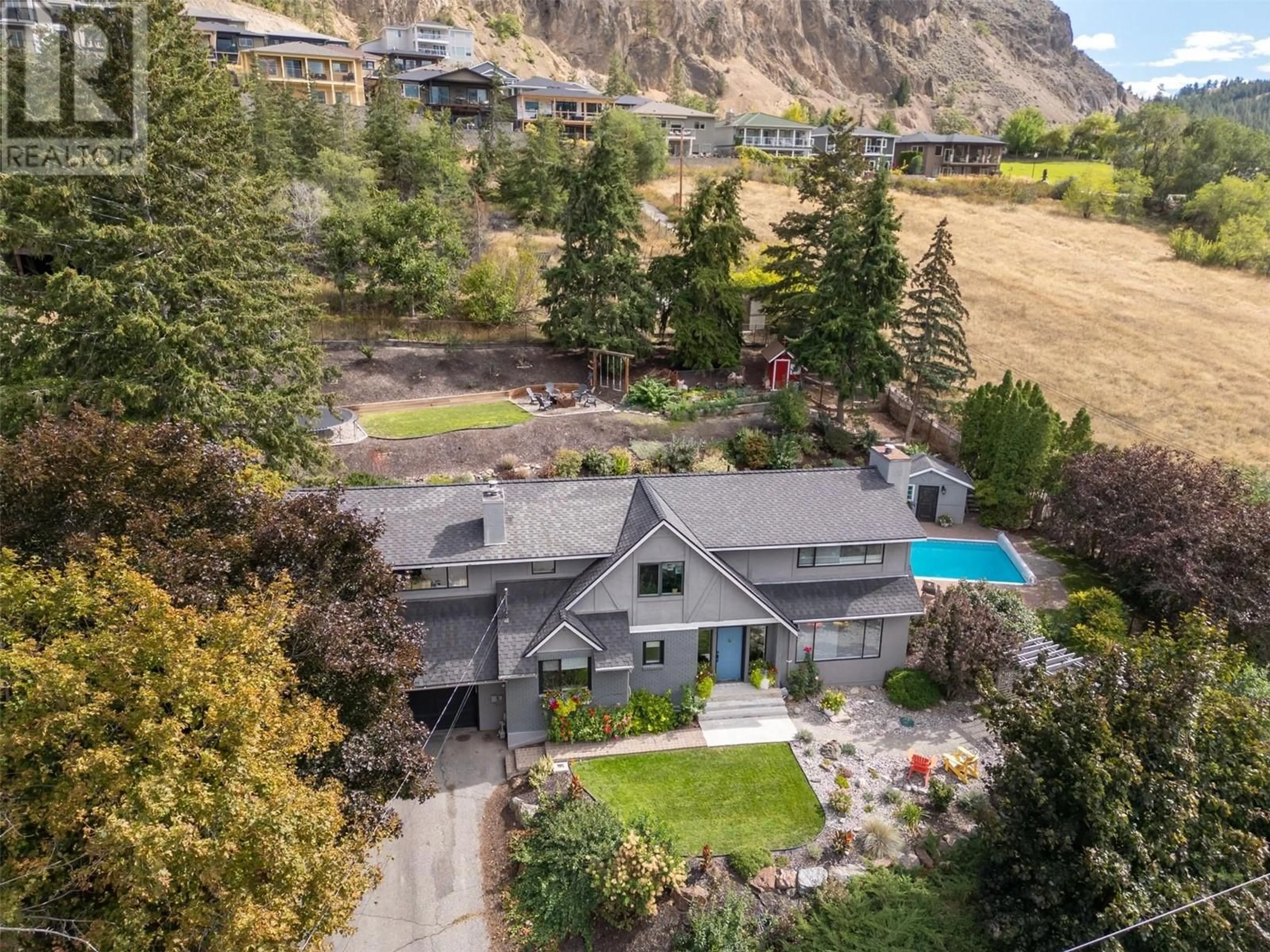 A pic from outside/outdoor area/front of a property/back of a property/a pic from drone, mountain view for 10613 Mountford Avenue, Summerland British Columbia V0H1Z2