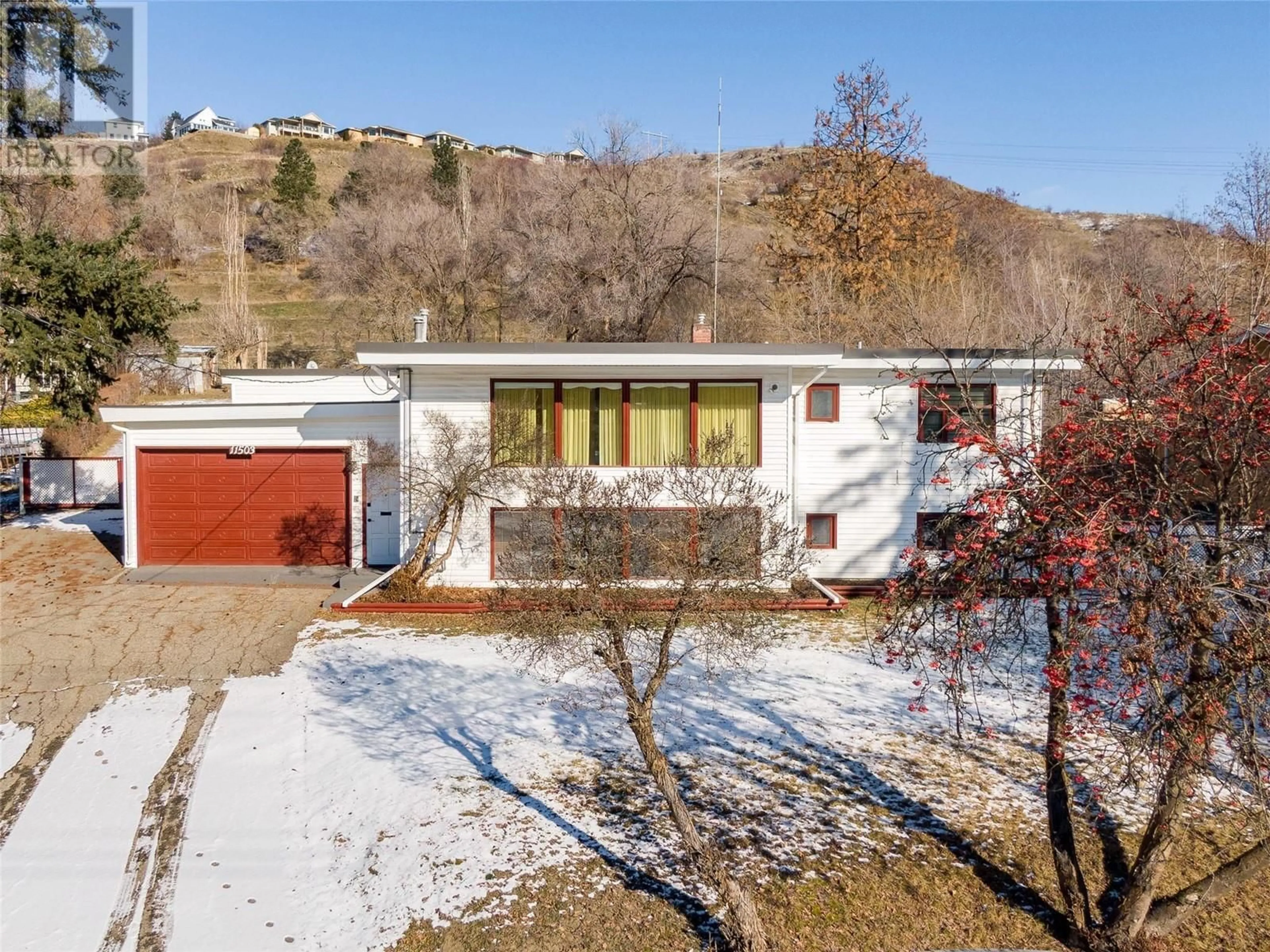 A pic from outside/outdoor area/front of a property/back of a property/a pic from drone, street for 11503 Kalamalka Road, Vernon British Columbia V1B1M2