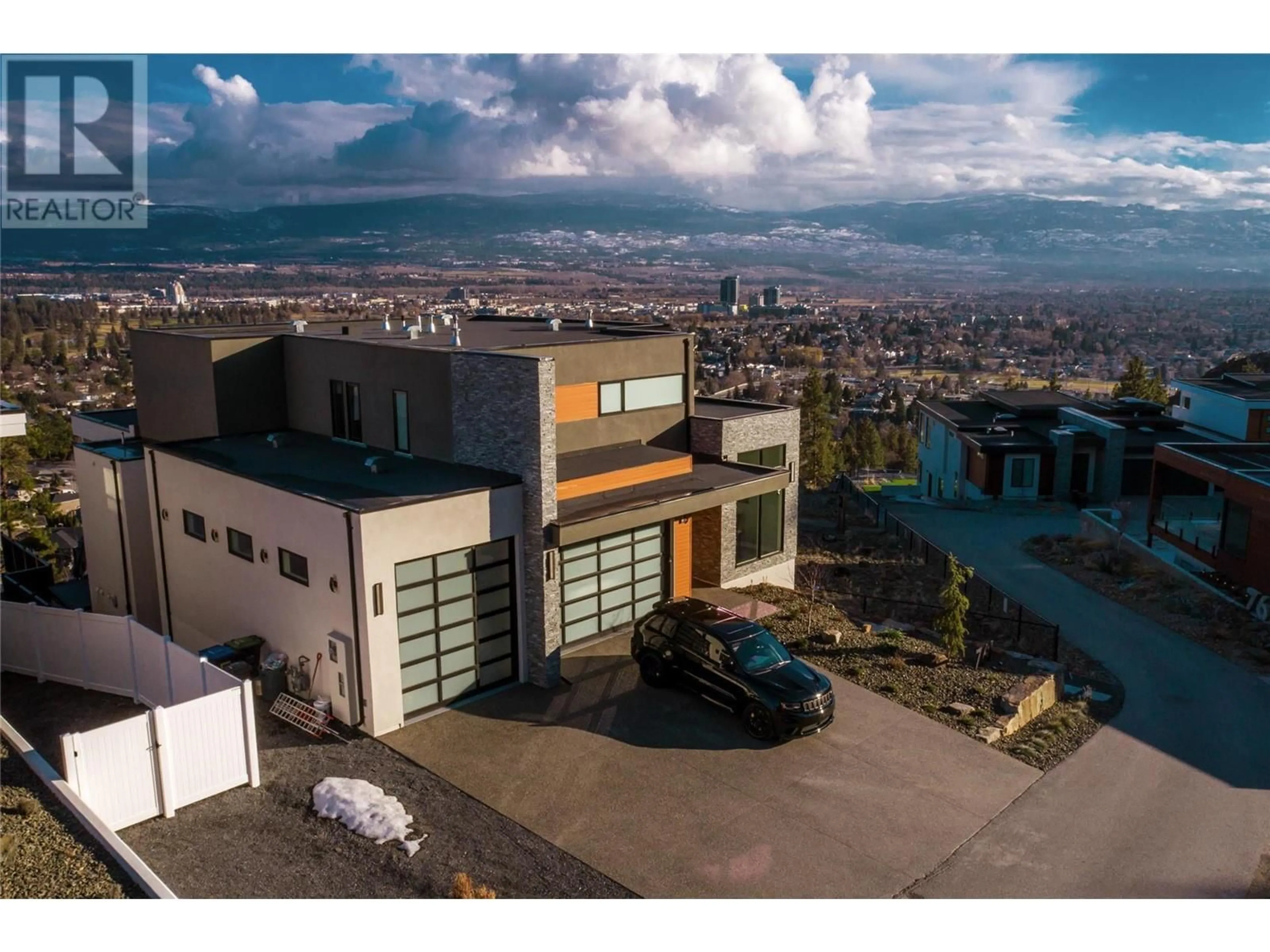 A pic from outside/outdoor area/front of a property/back of a property/a pic from drone, mountain view for 761 Highpointe Lane, Kelowna British Columbia V1V2Y1